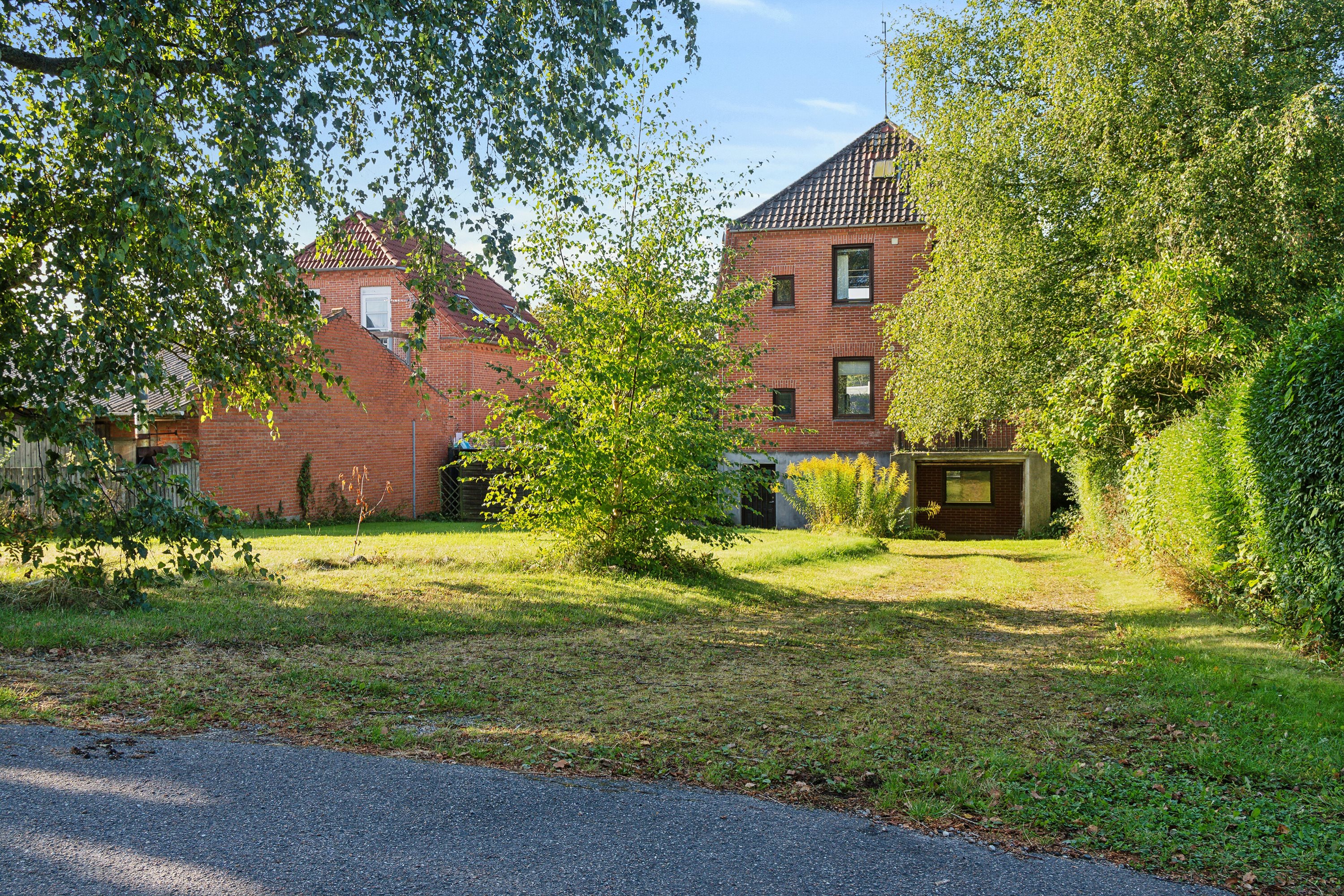 Fremhævet set fra haven billede i fuldskærmstilstand. Billede af Fåborgvej 24, 5700 Svendborg