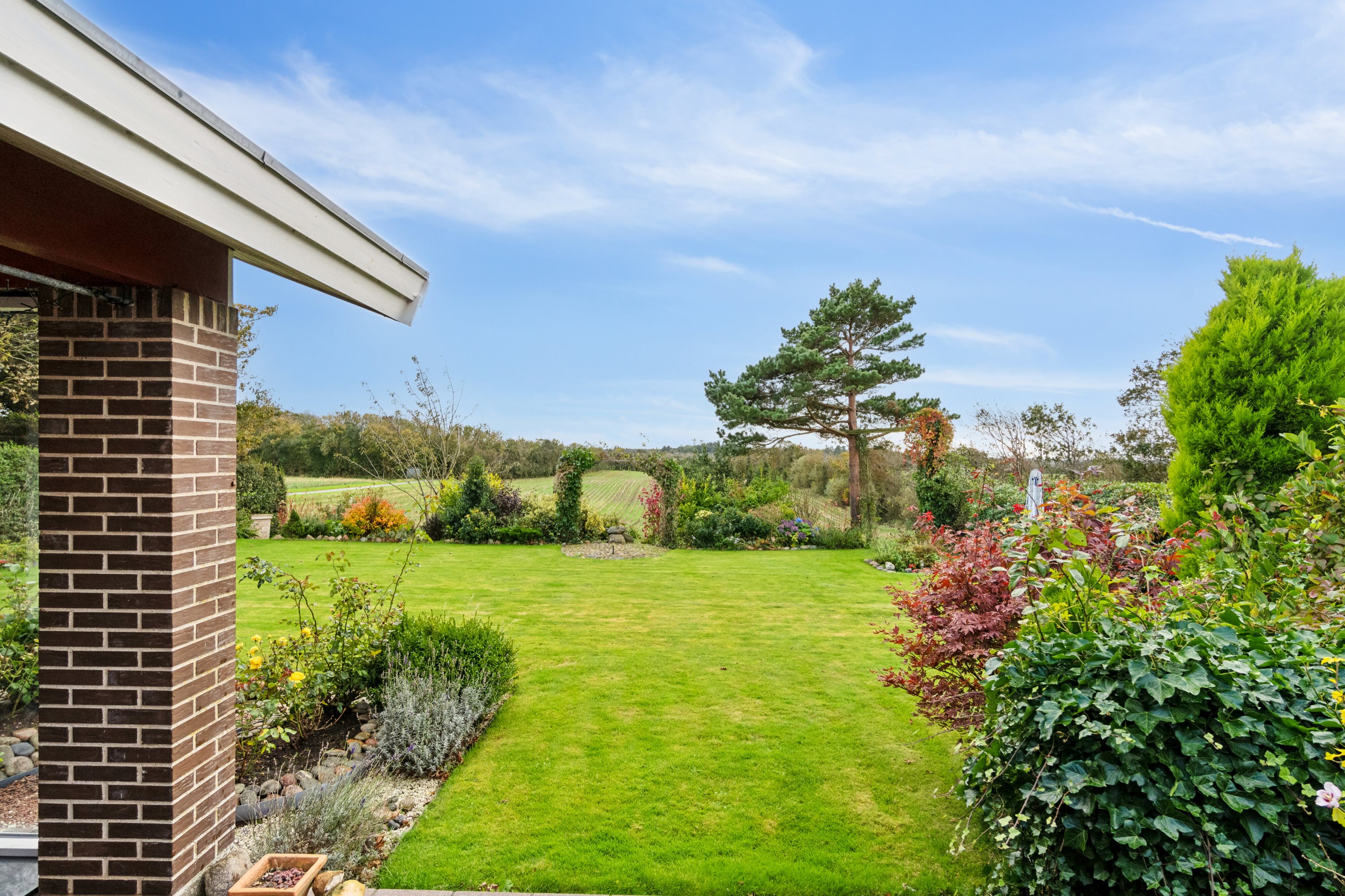 Fremhævet set fra haven billede i fuldskærmstilstand. Billede af Møllevangen 18, Hørdum, 7752 Snedsted