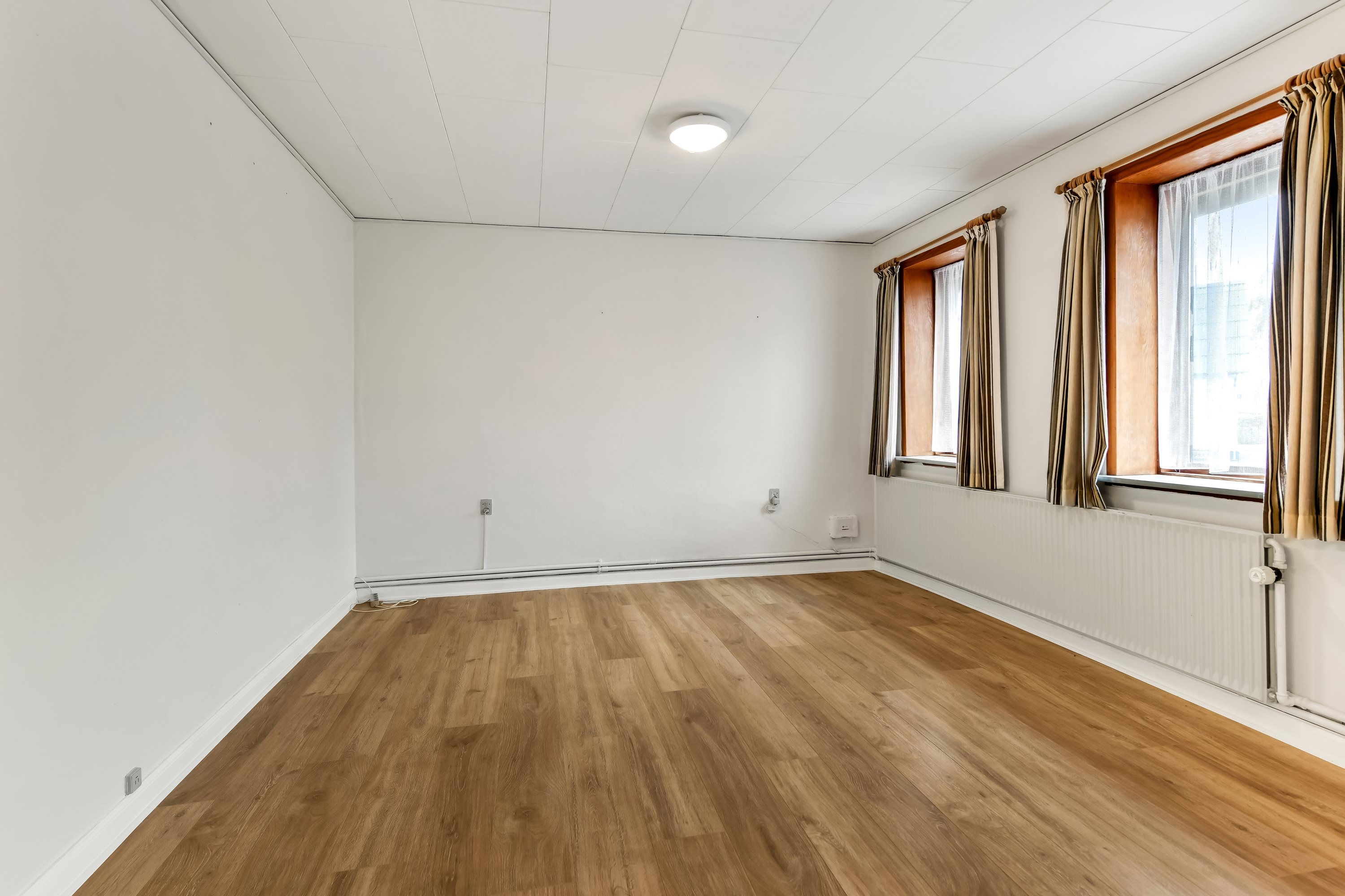 Fremhævet stue billede i fuldskærmstilstand. Billede af Skads Byvej 56, 6705 Esbjerg Ø