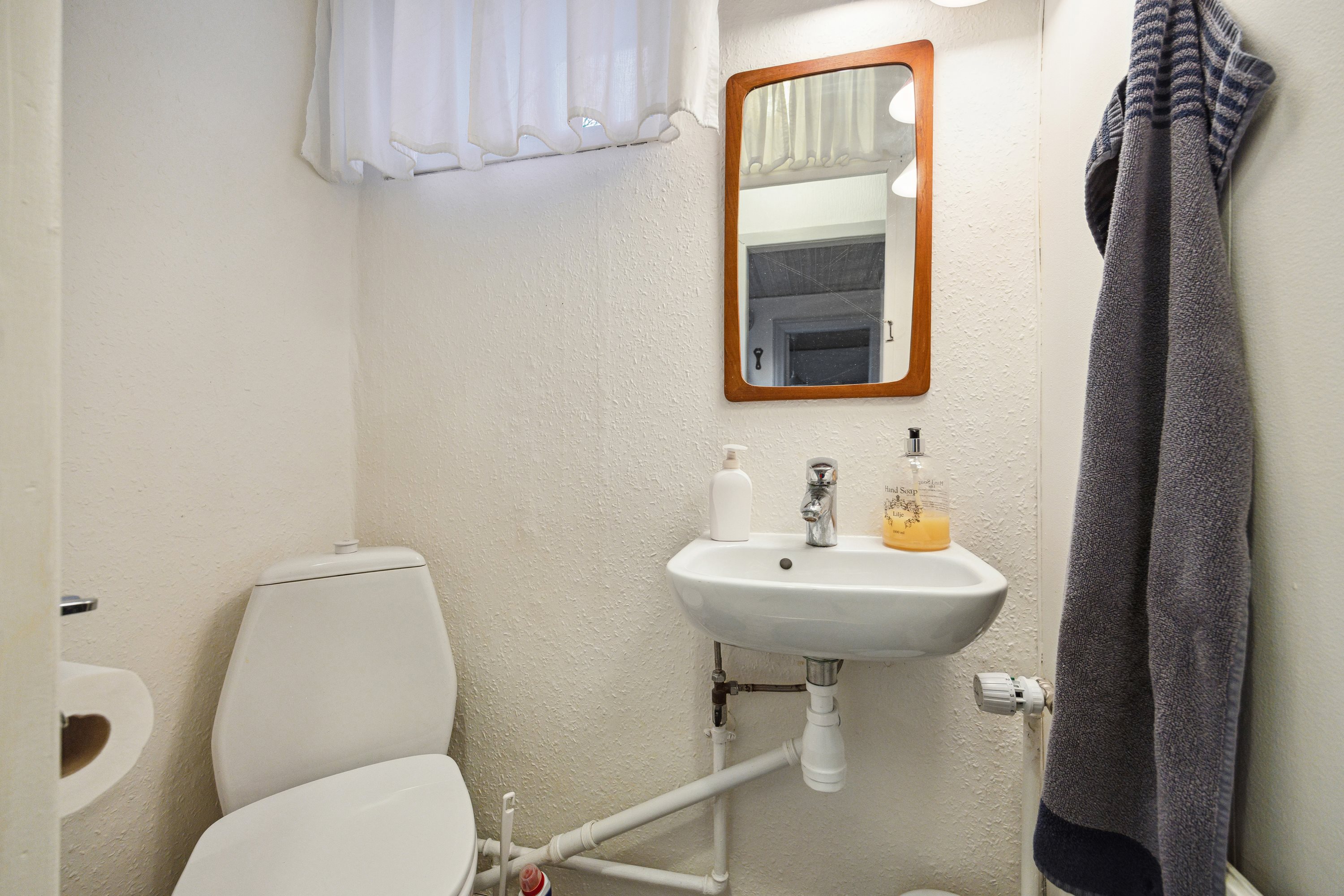 Fremhævet badeværelse billede i fuldskærmstilstand. Billede af Rolighedsvej 1, 9493 Saltum