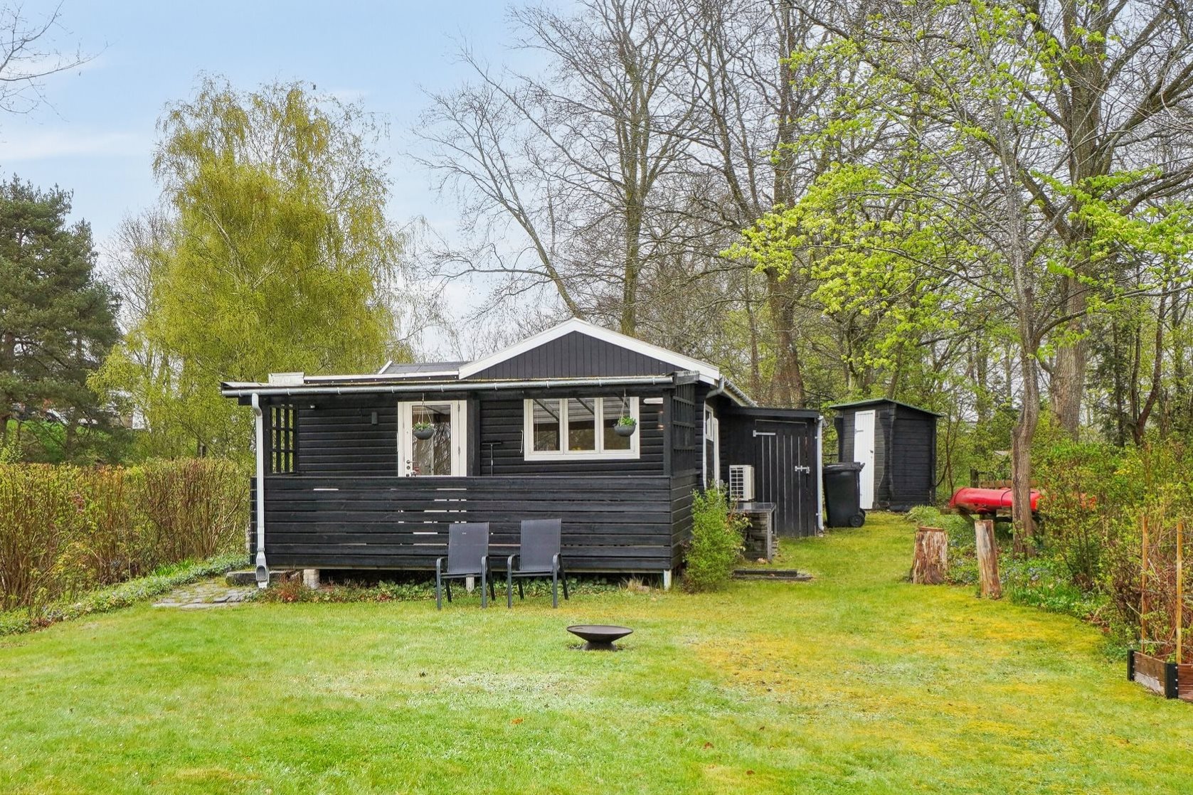 Fremhævet set fra haven billede i fuldskærmstilstand. Billede af C.A. Nielsensvej 31, Ølsted Strandhuse, 3310 Ølsted