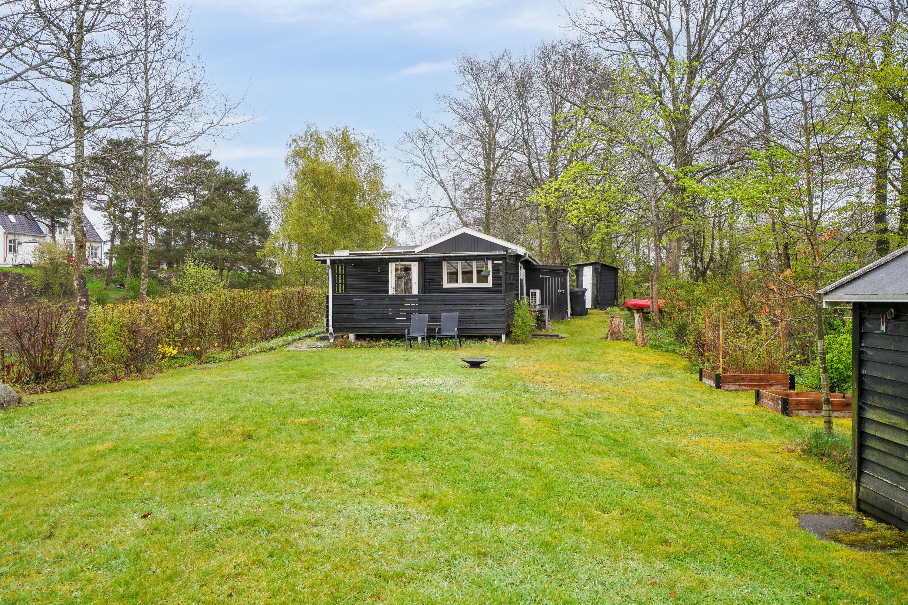 Fremhævet set fra haven billede i fuldskærmstilstand. Billede af C.A. Nielsensvej 31, Ølsted Strandhuse, 3310 Ølsted
