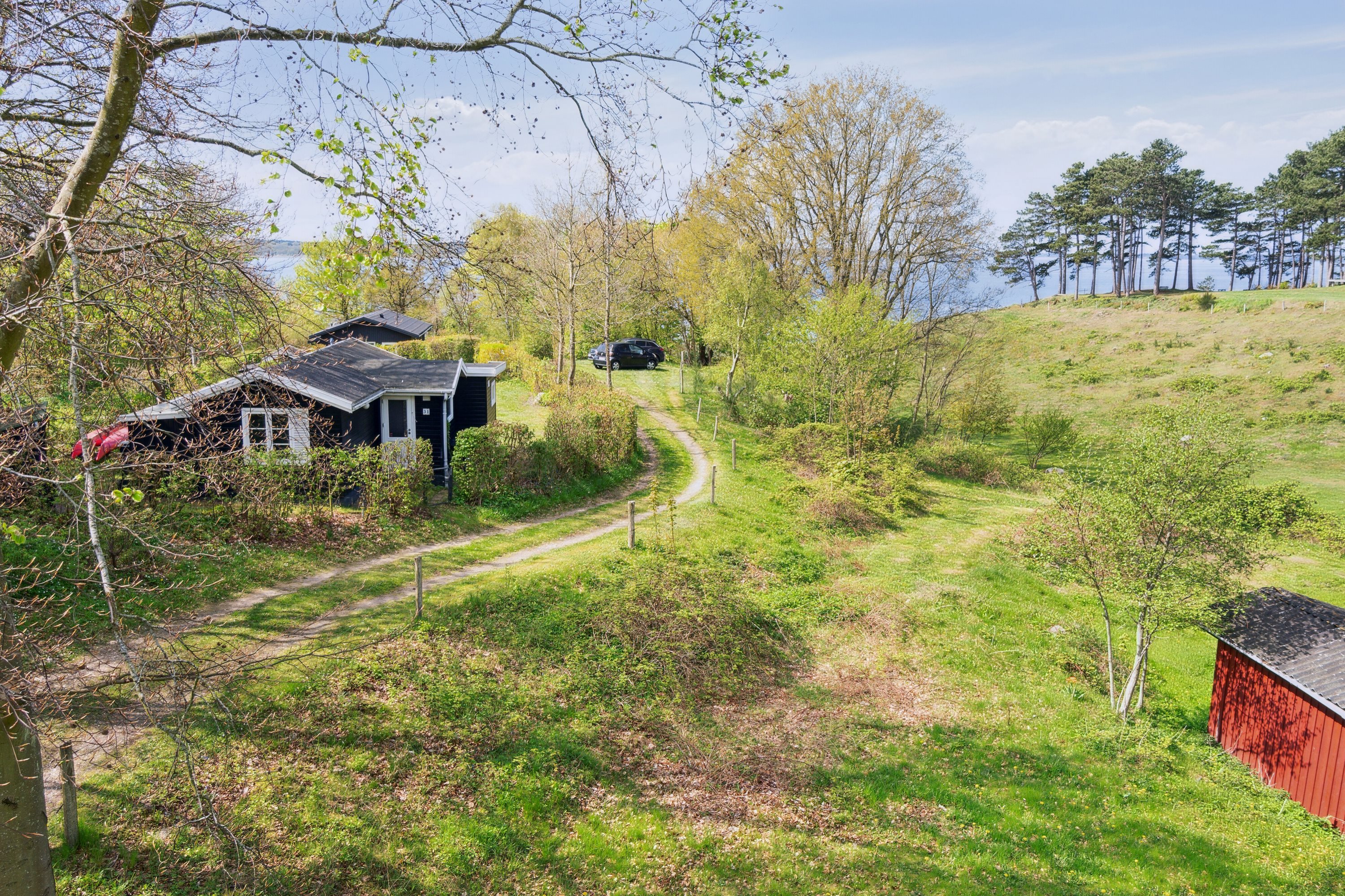 Fremhævet udendørs billede i fuldskærmstilstand. Billede af C.A. Nielsensvej 31, Ølsted Strandhuse, 3310 Ølsted