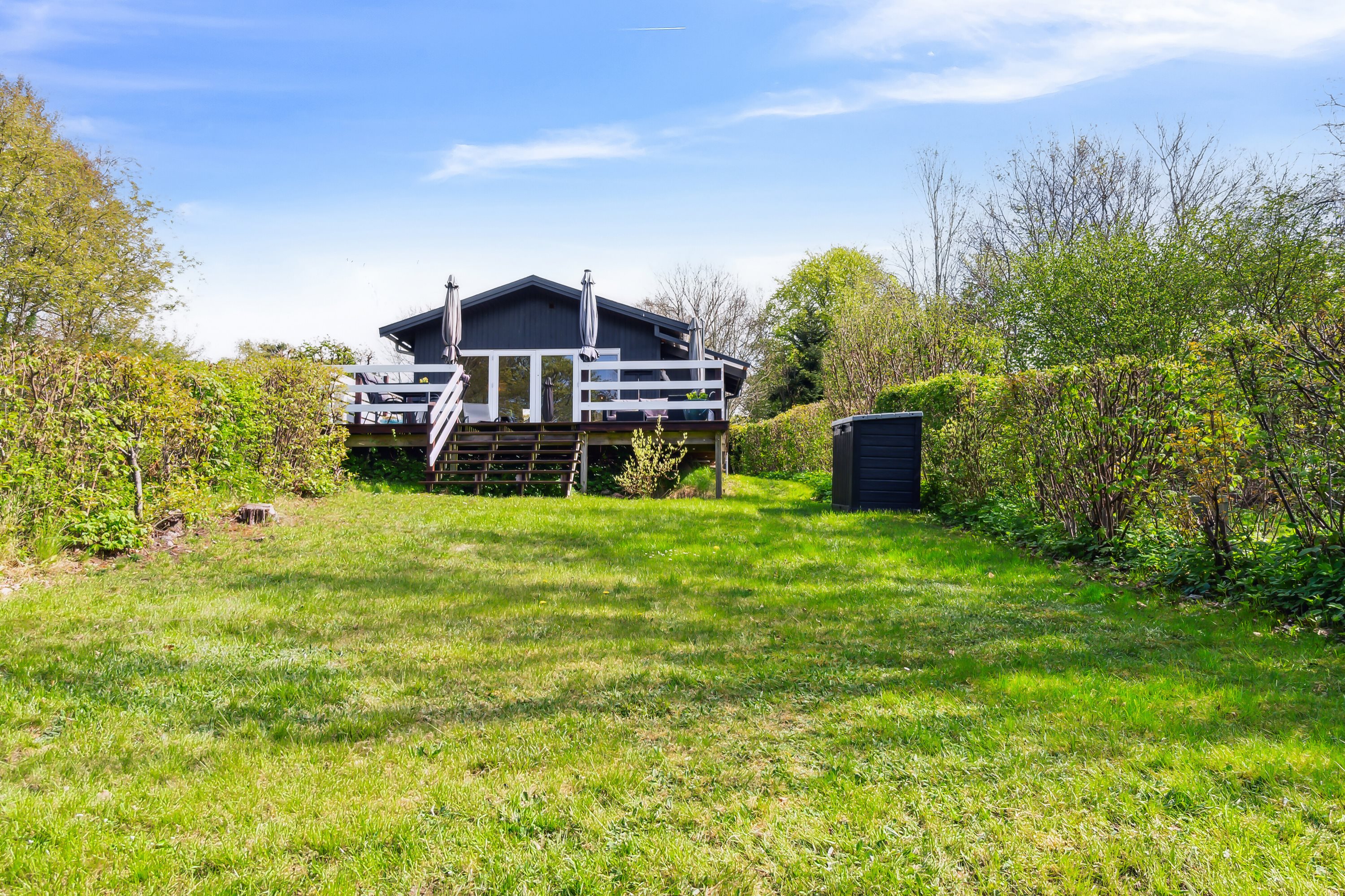 Fremhævet set fra haven billede i fuldskærmstilstand. Billede af C.A. Nielsensvej 33, Ølsted Strandhuse, 3310 Ølsted