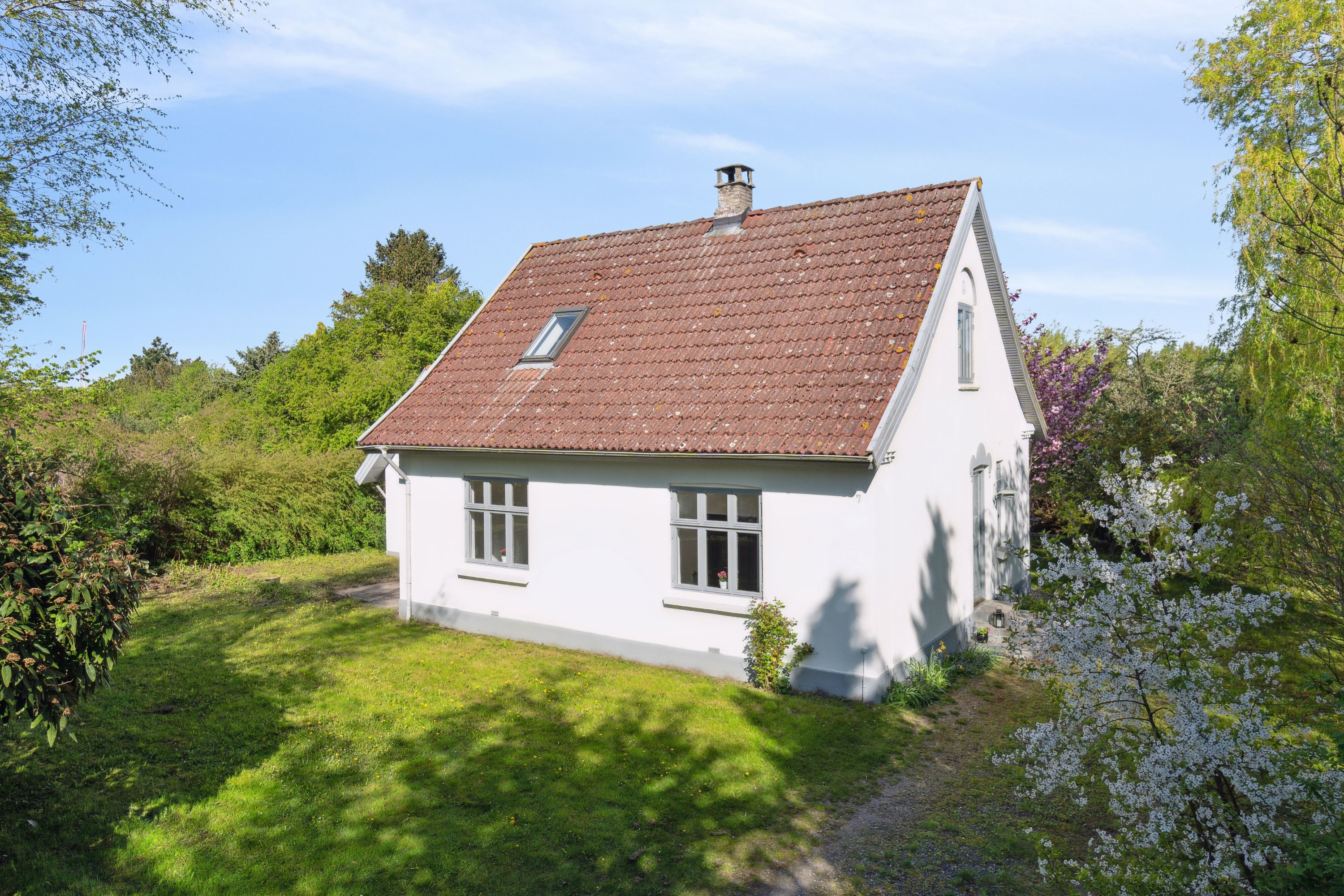 Fremhævet set fra haven billede i fuldskærmstilstand. Billede af Ved Gadekæret 7, Skibinge, 4720 Præstø