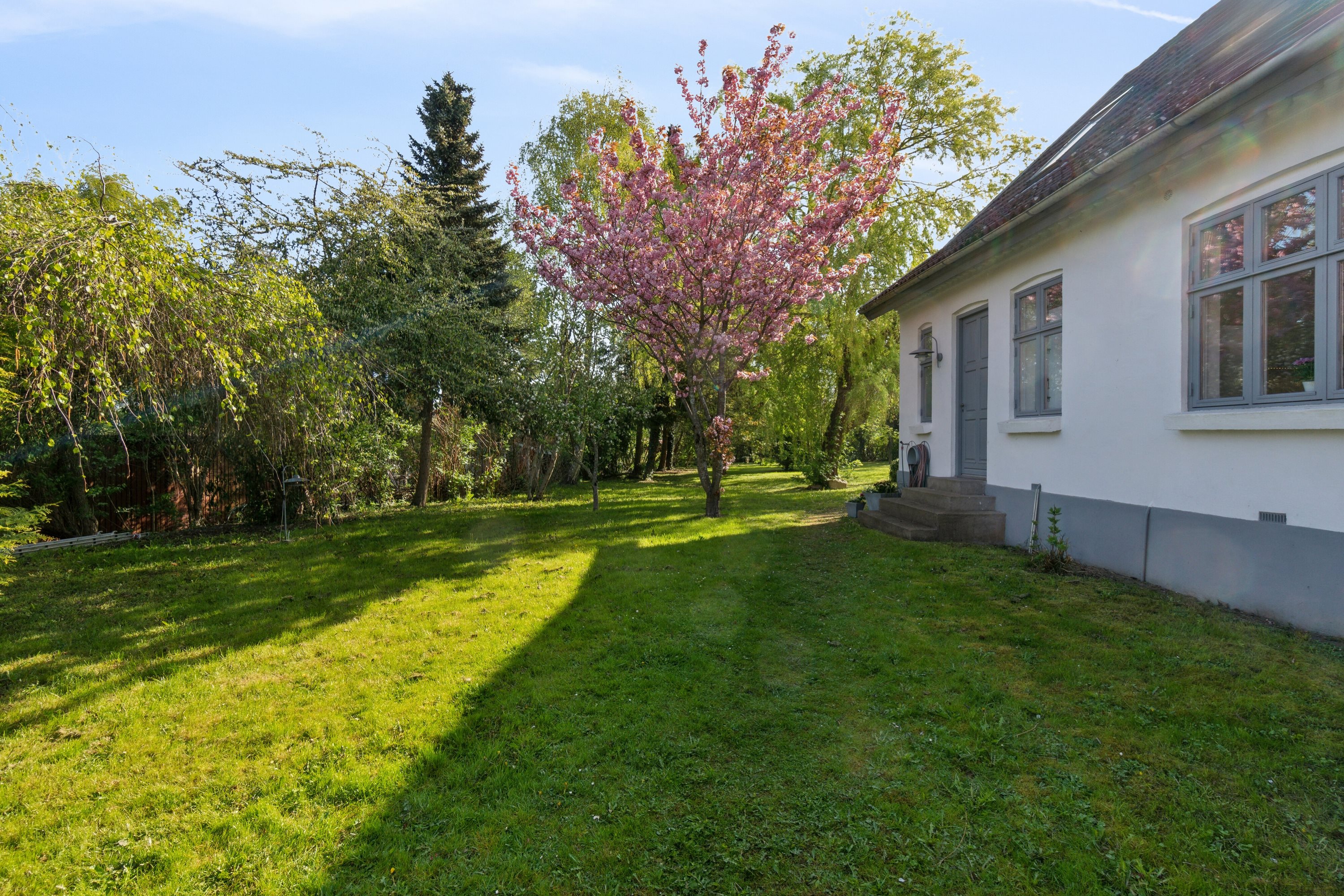 Fremhævet set fra haven billede i fuldskærmstilstand. Billede af Ved Gadekæret 7, Skibinge, 4720 Præstø