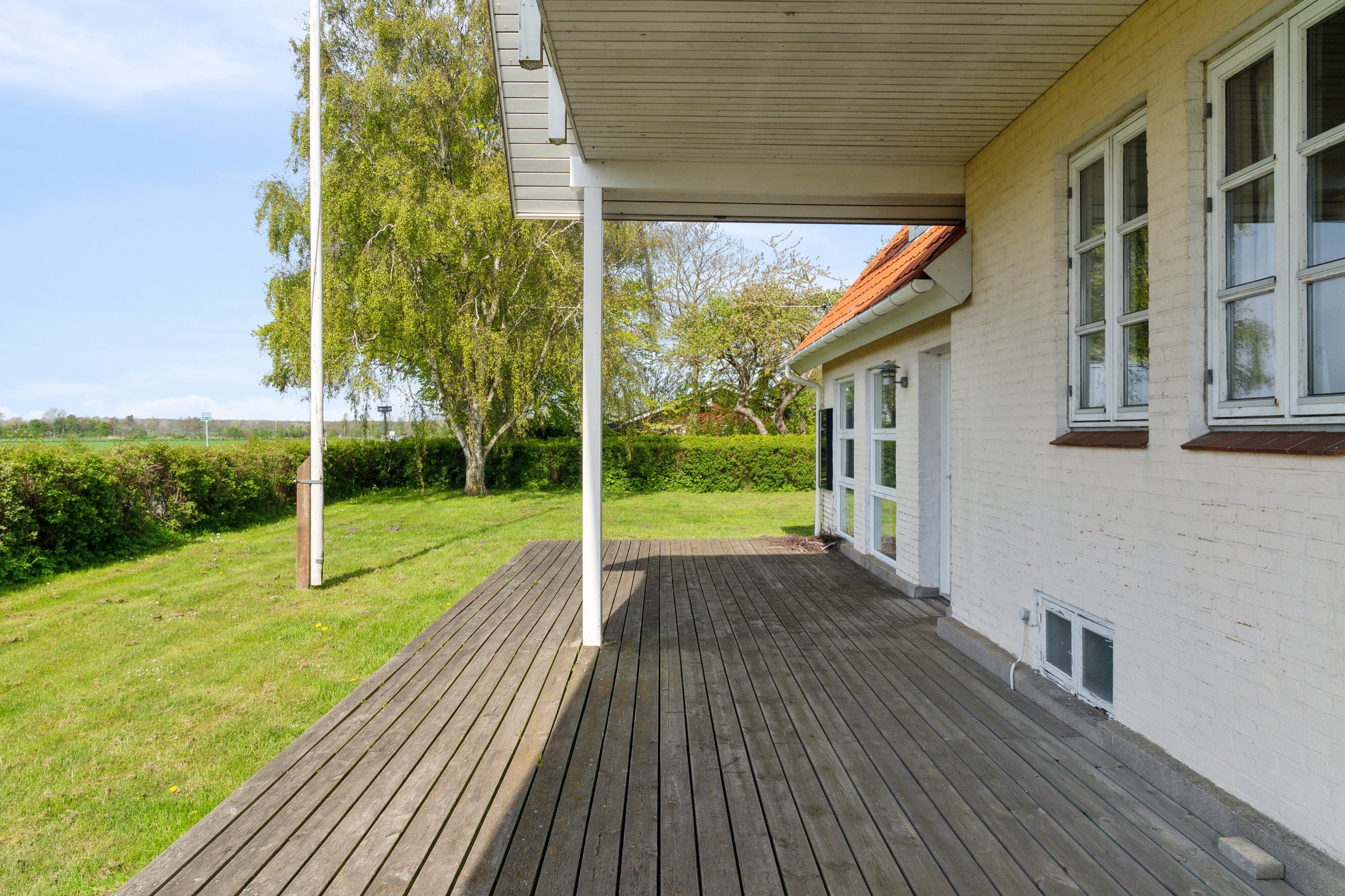 Fremhævet terrasse billede i fuldskærmstilstand. Billede af Degnegyden 1, Kristiansminde, 5450 Otterup