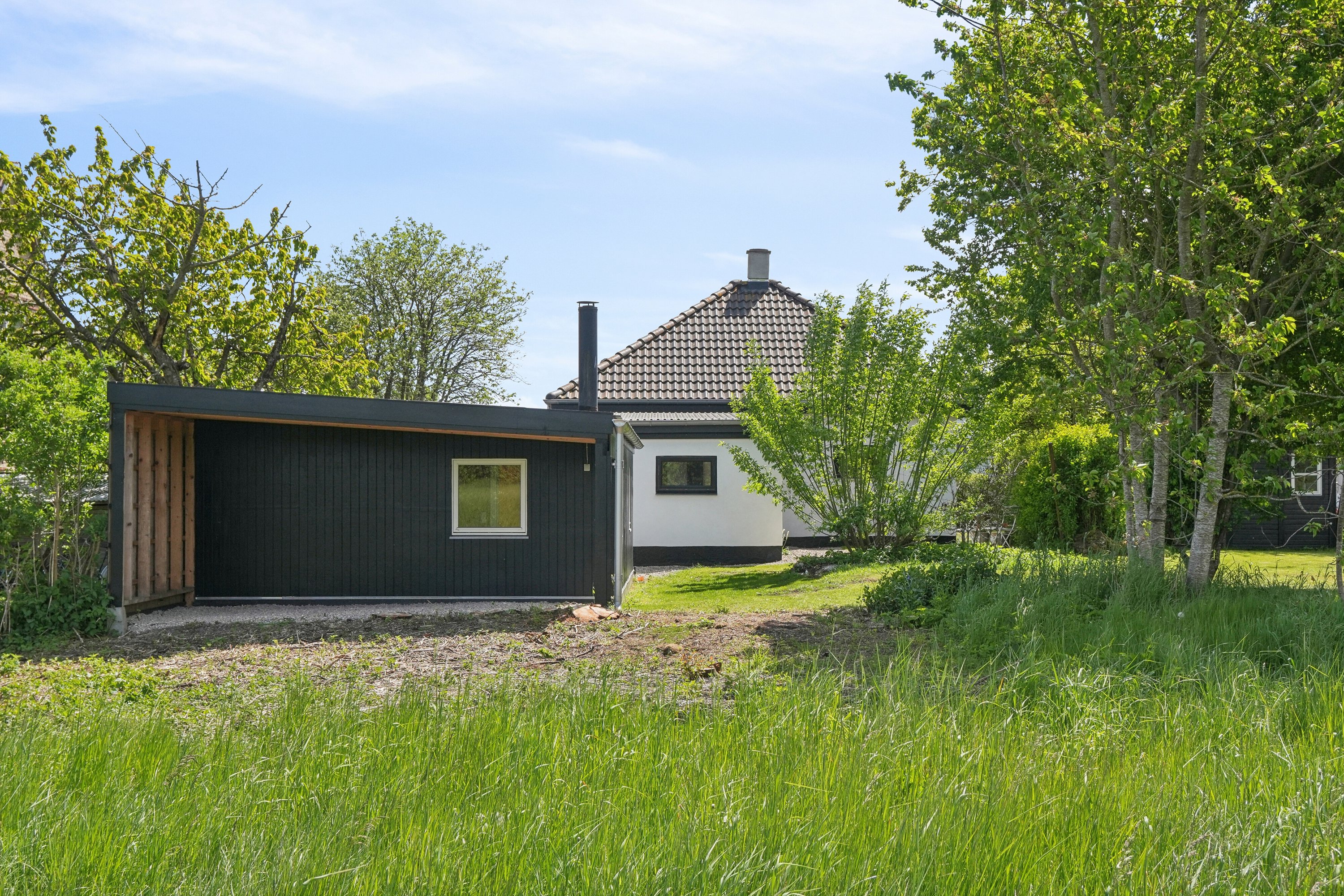 Fremhævet set fra haven billede i fuldskærmstilstand. Billede af Nyvej 22, Ulbølle, 5762 Vester Skerninge