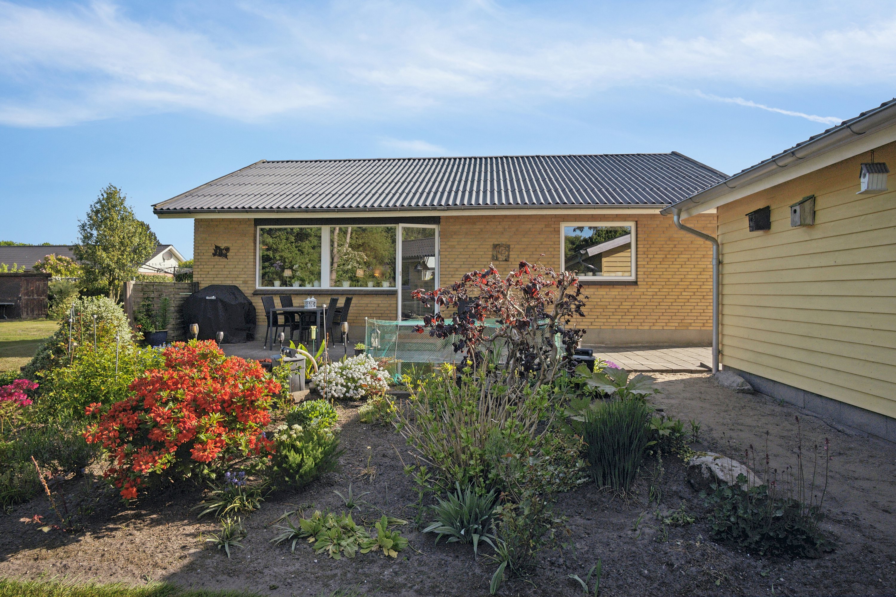 Fremhævet ejendommen set fra haven billede i fuldskærmstilstand. Billede af Ellundvej 5, Bov, 6330 Padborg