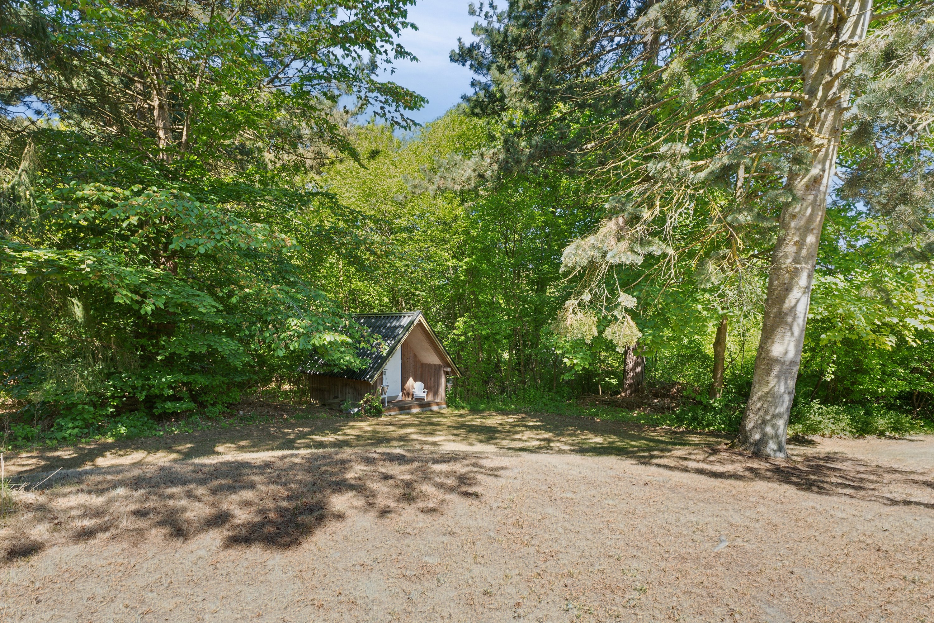 Fremhævet set fra haven billede i fuldskærmstilstand. Billede af Fyrrevangen 8, Asserbo, 3300 Frederiksværk