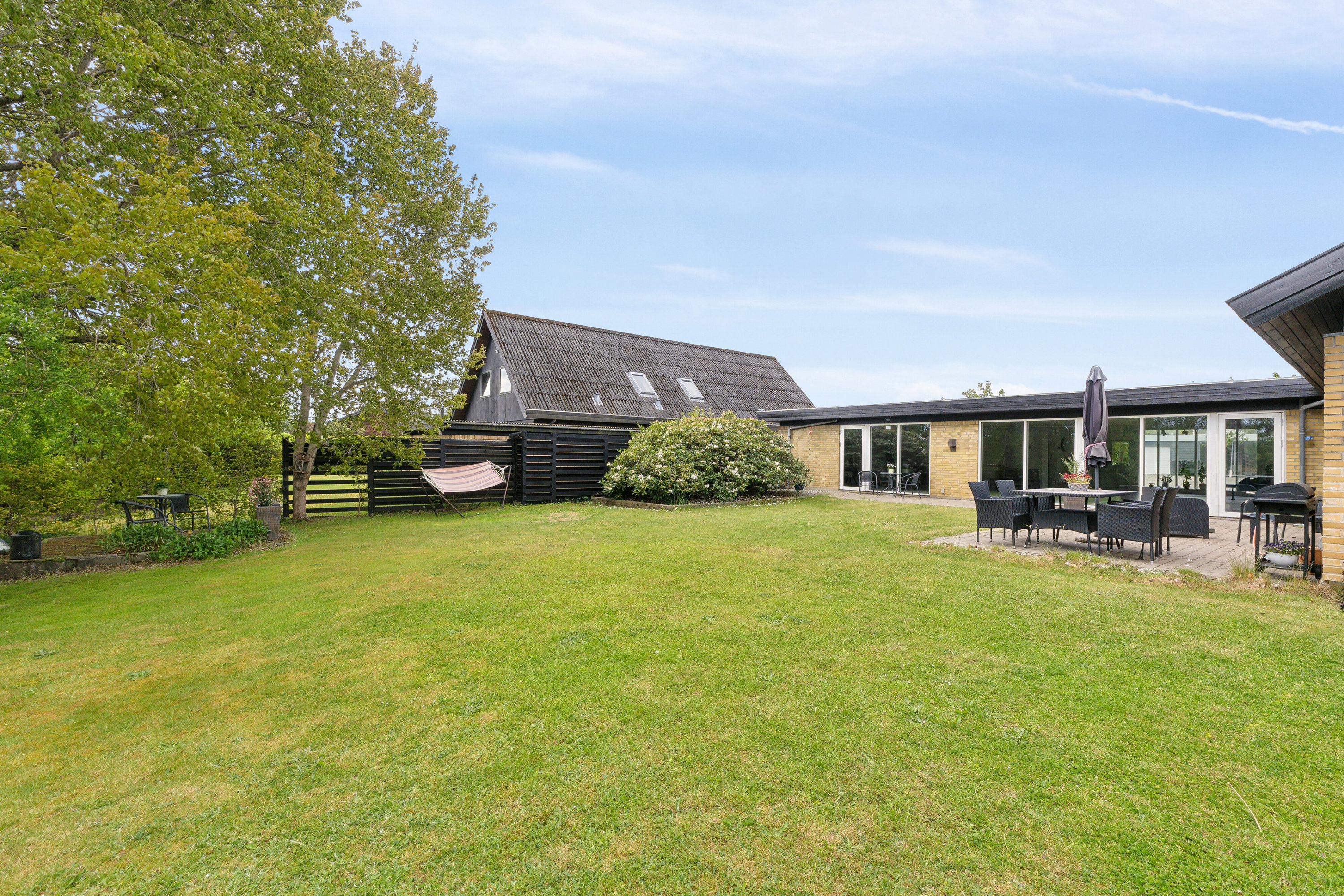 Fremhævet set fra haven billede i fuldskærmstilstand. Billede af Frejasvej 9, 9870 Sindal