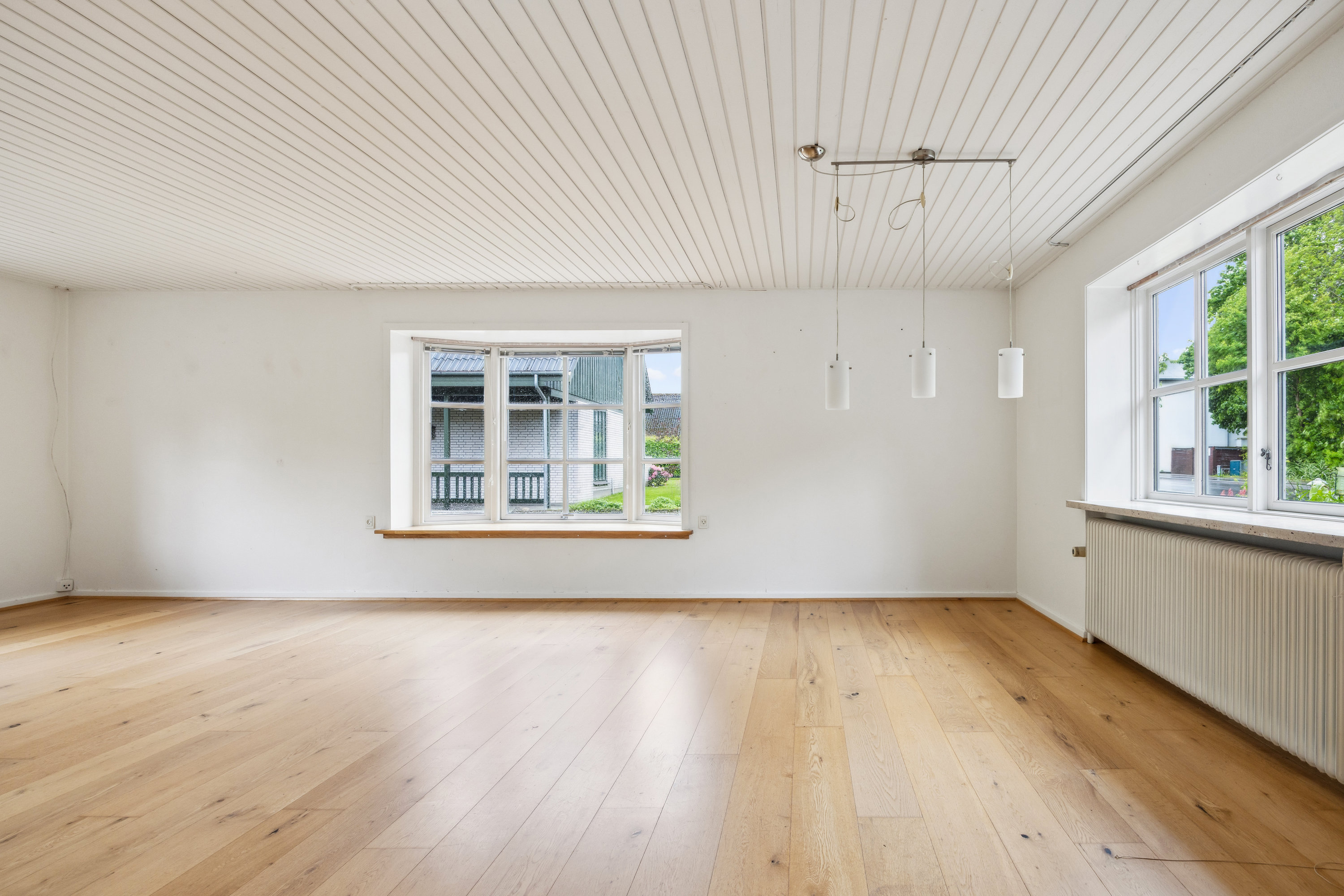 Fremhævet stue billede i fuldskærmstilstand. Billede af Nørre Alle 12, 9320 Hjallerup