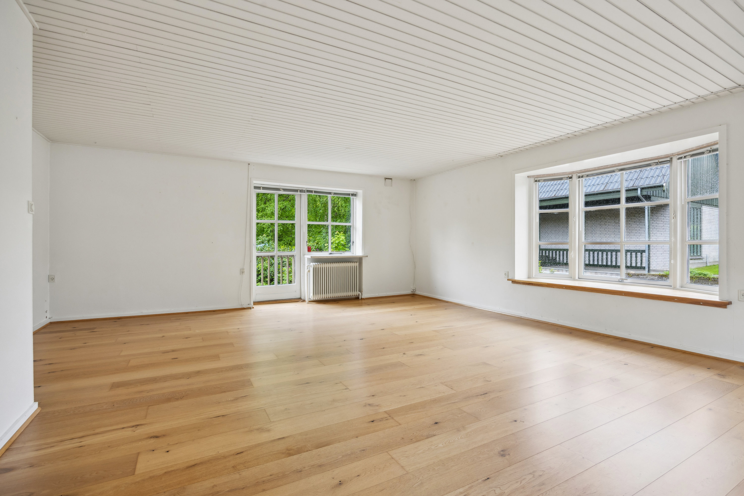 Fremhævet stue billede i fuldskærmstilstand. Billede af Nørre Alle 12, 9320 Hjallerup