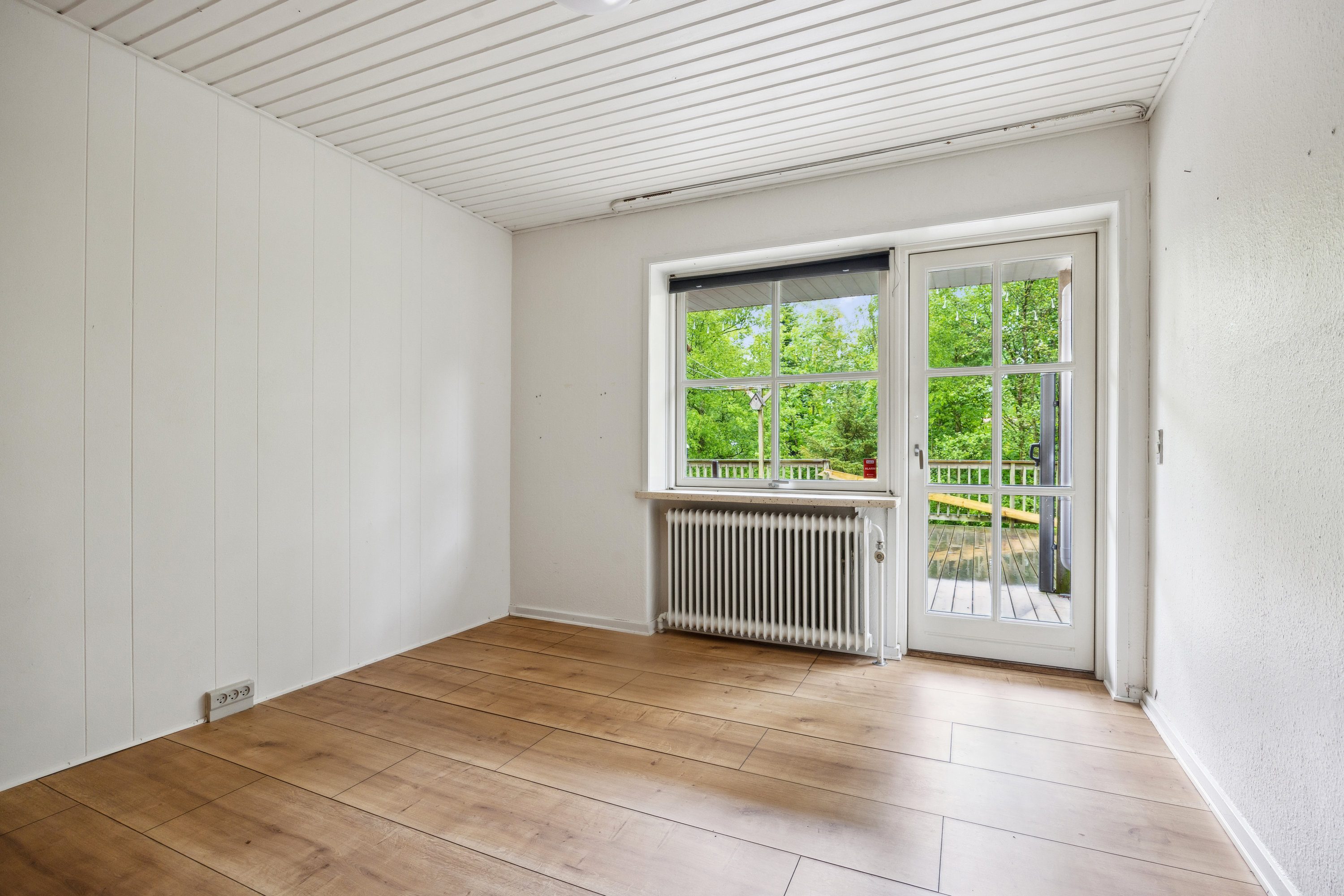 Fremhævet stue billede i fuldskærmstilstand. Billede af Nørre Alle 12, 9320 Hjallerup