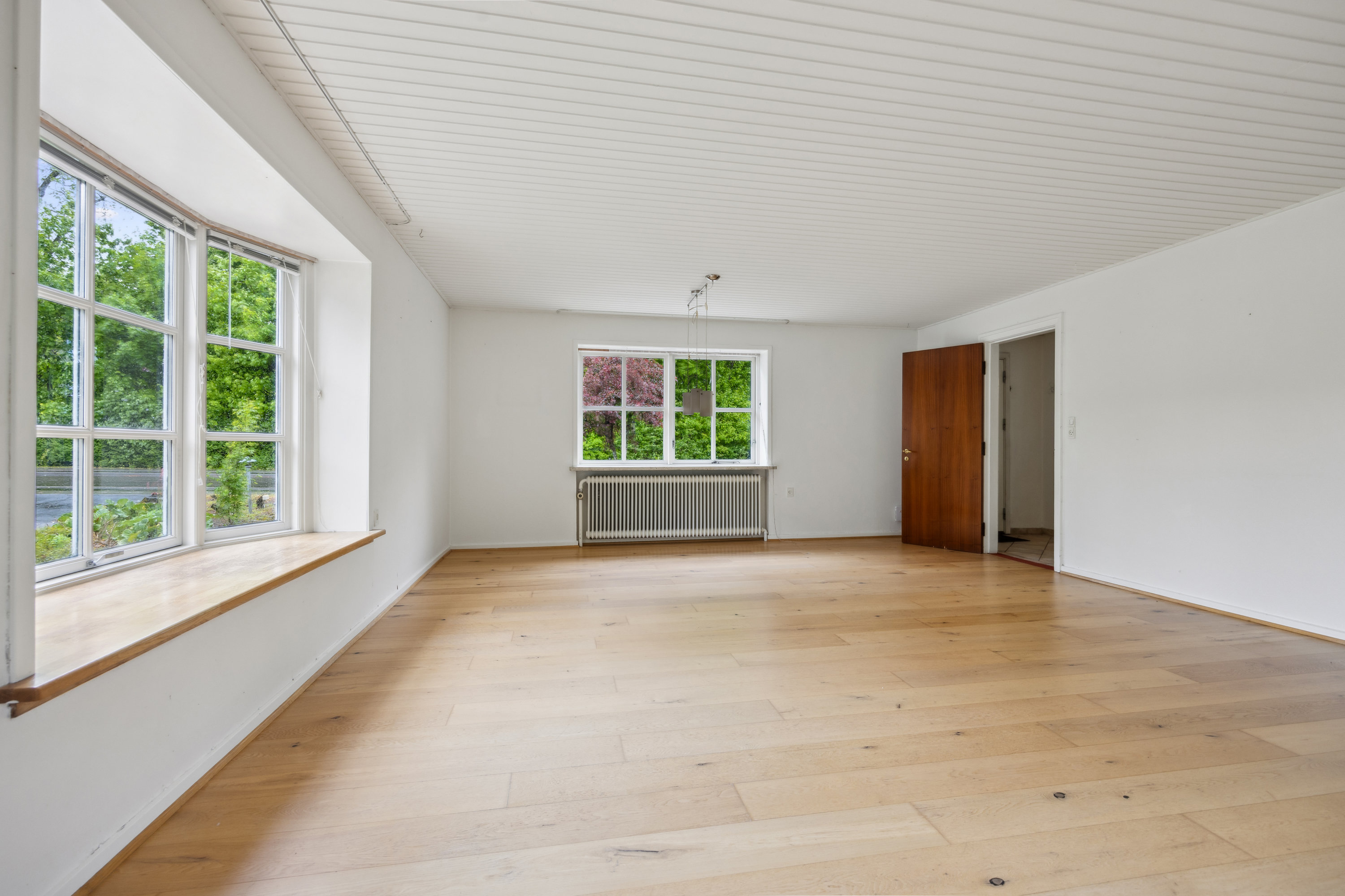 Fremhævet stue billede i fuldskærmstilstand. Billede af Nørre Alle 12, 9320 Hjallerup