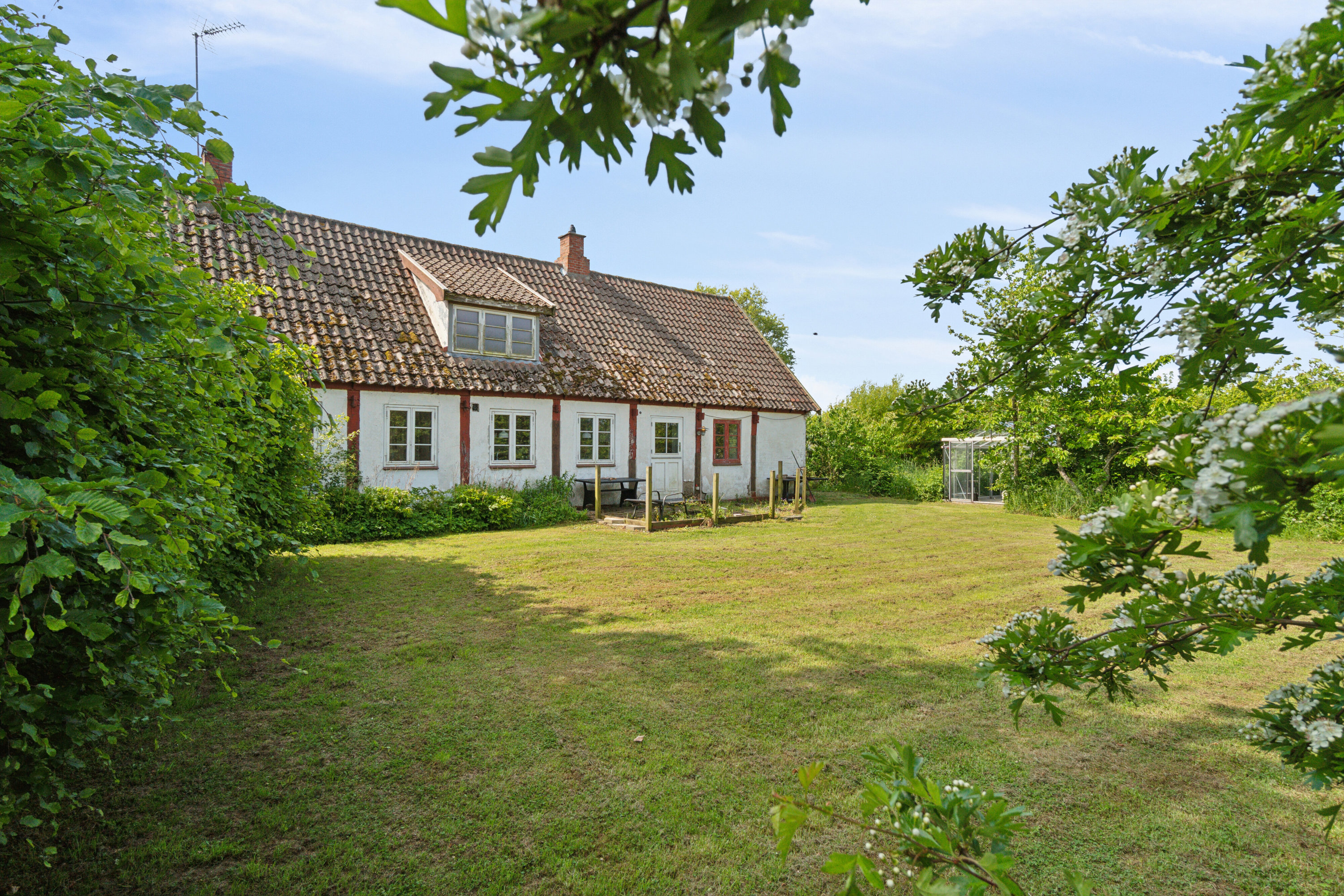 Fremhævet set fra haven billede i fuldskærmstilstand. Billede af Krakvej 6, Poulsker, 3730 Nexø