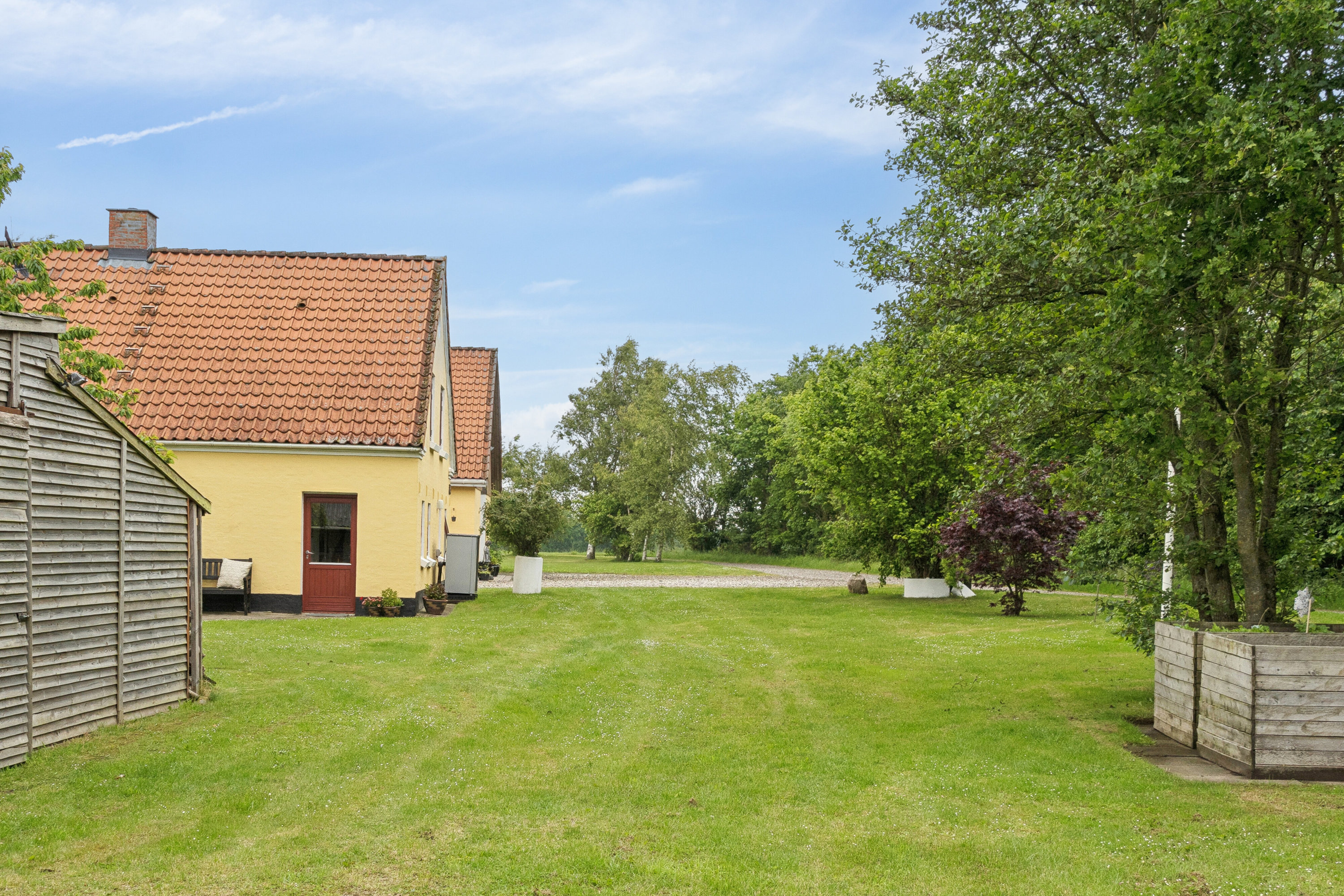 Fremhævet set fra haven billede i fuldskærmstilstand. Billede af Pletvej 135, Mosbjerg, 9870 Sindal