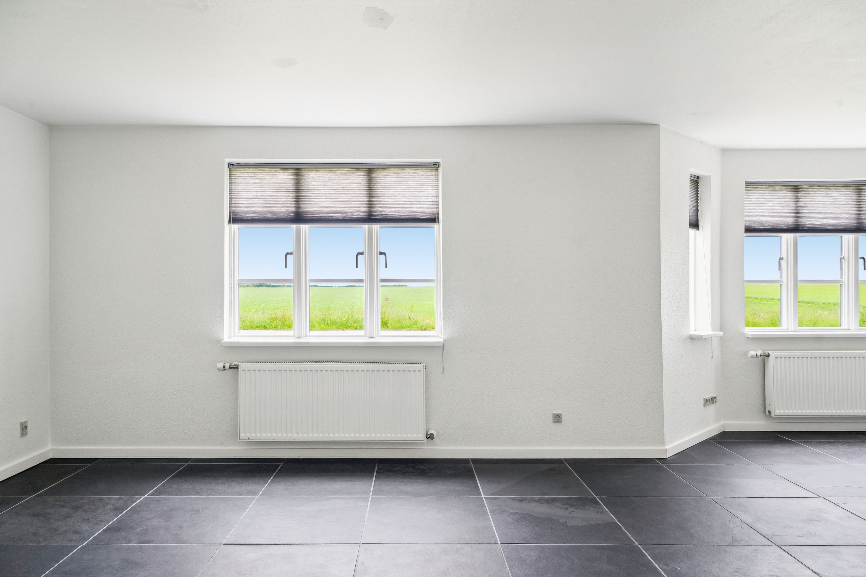 Fremhævet stue billede i fuldskærmstilstand. Billede af Houtvedvej 29, Oue, 9500 Hobro