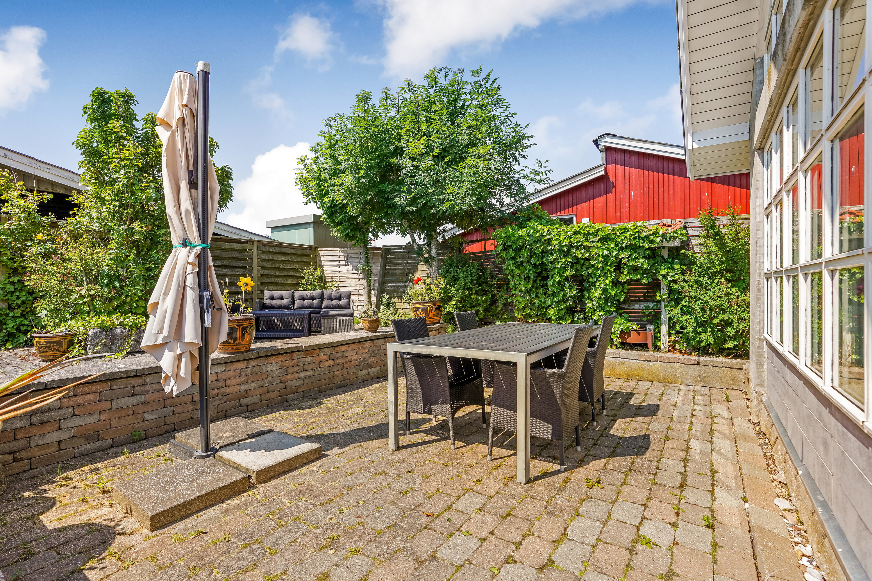 Fremhævet terrasse billede i fuldskærmstilstand. Billede af Henningsensvej 15, Hasmark Strand, 5450 Otterup