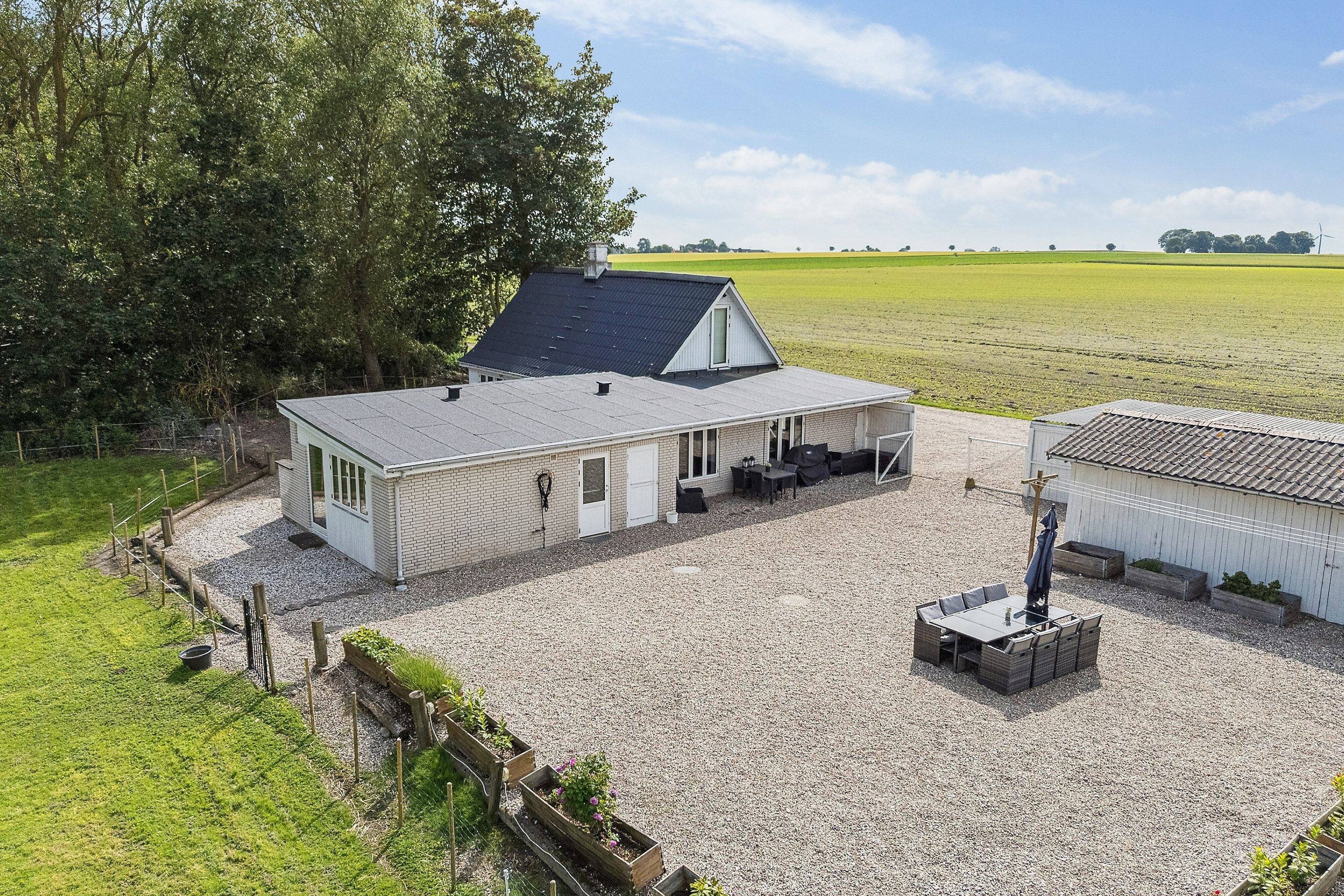 Fremhævet set fra haven billede i fuldskærmstilstand. Billede af Lodagervej 10, Hejninge, 4200 Slagelse