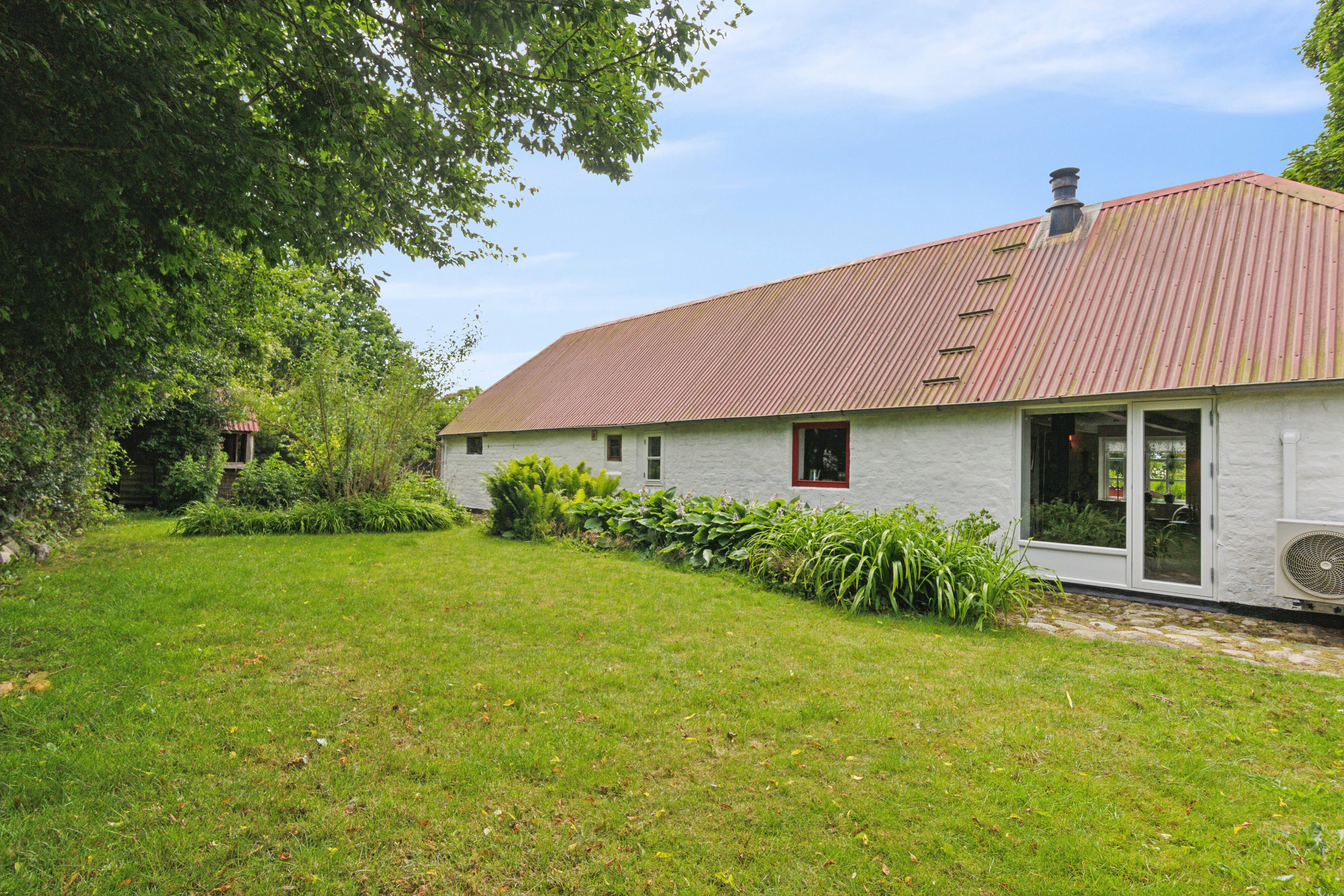 Fremhævet set fra haven billede i fuldskærmstilstand. Billede af Borgergade 36, Koldby, 7752 Snedsted