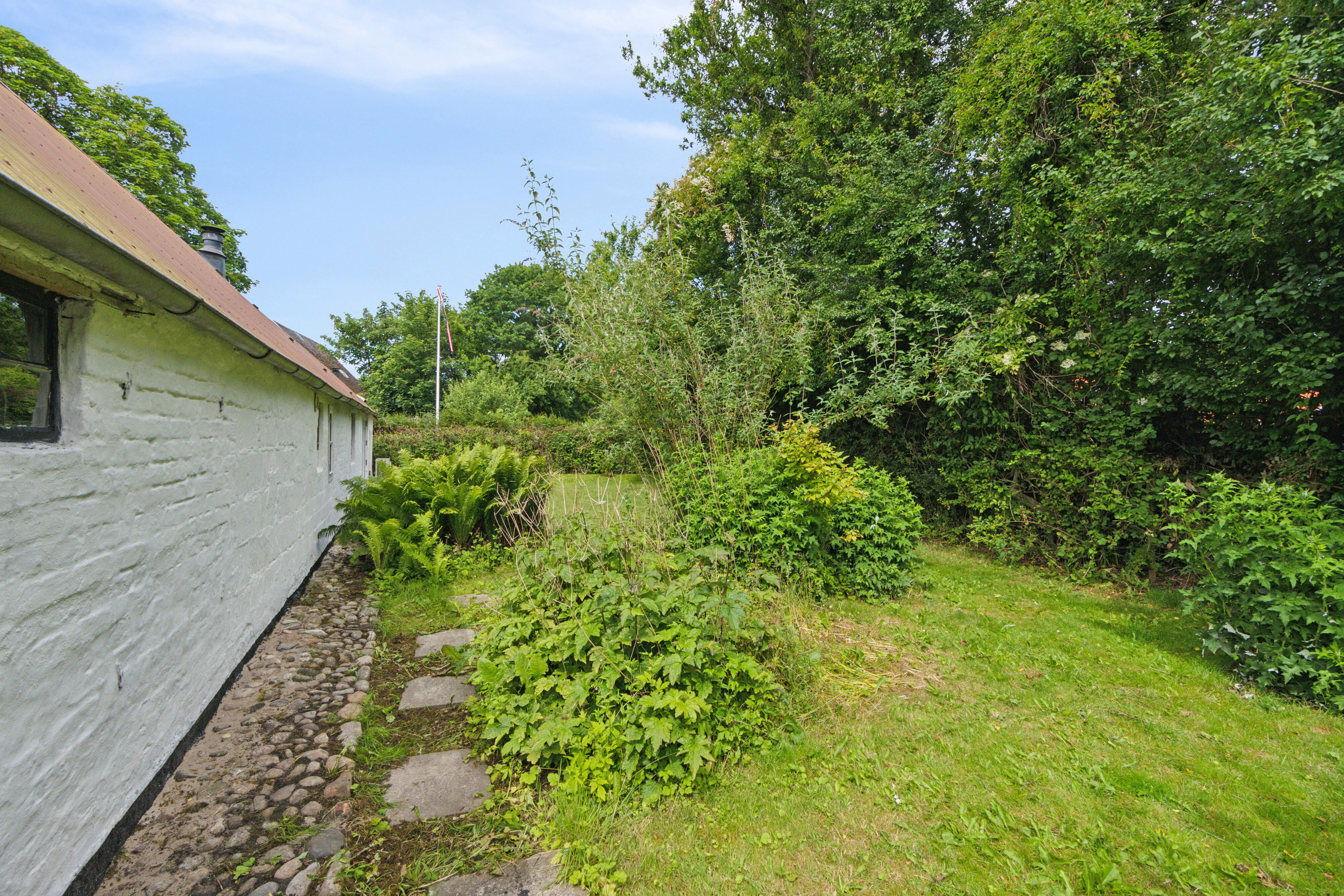 Fremhævet set fra haven billede i fuldskærmstilstand. Billede af Borgergade 36, Koldby, 7752 Snedsted