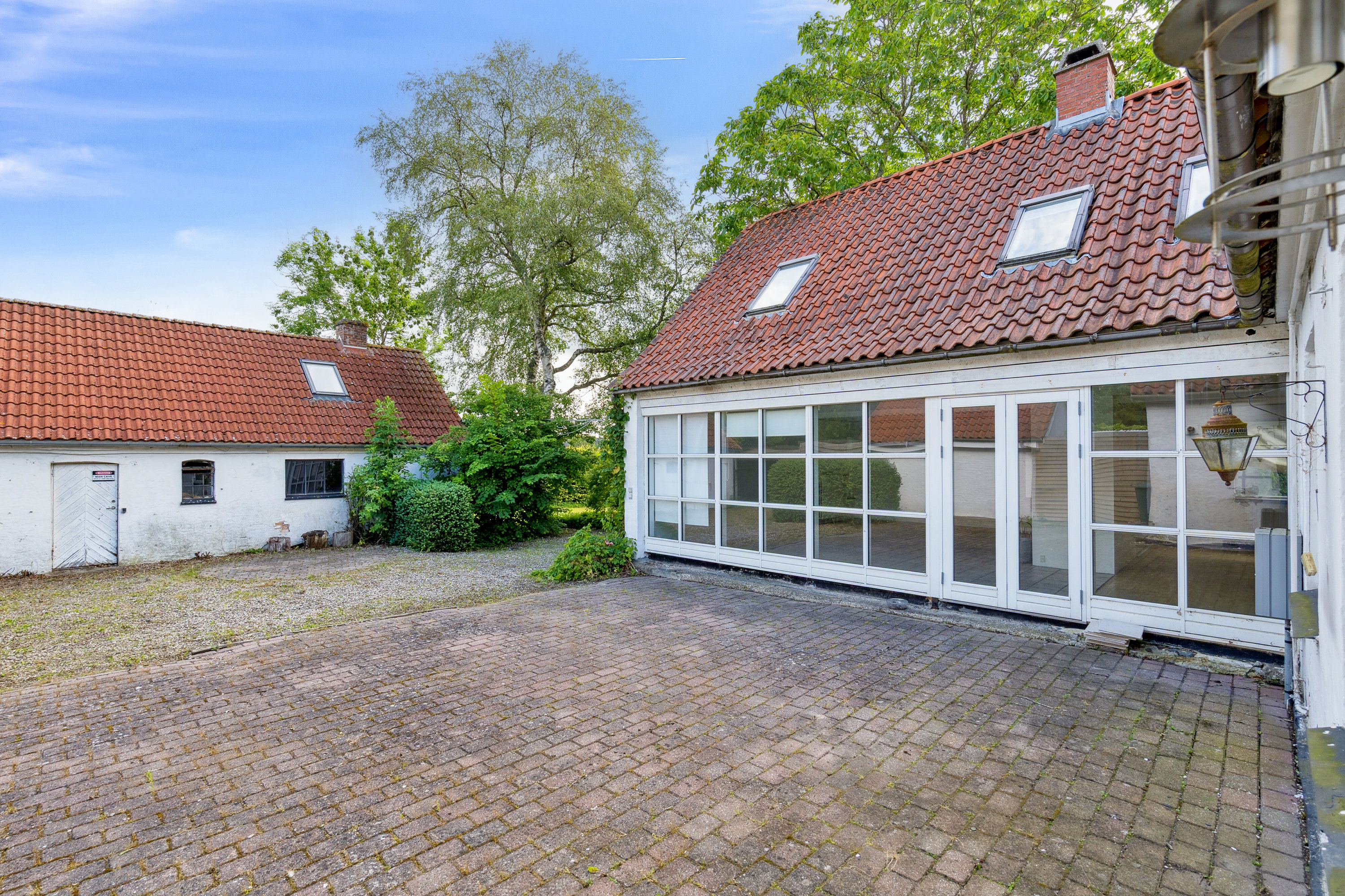 Fremhævet set fra vejen billede i fuldskærmstilstand. Billede af Kirkevænget 12, Holme-Olstrup, 4684 Holmegaard