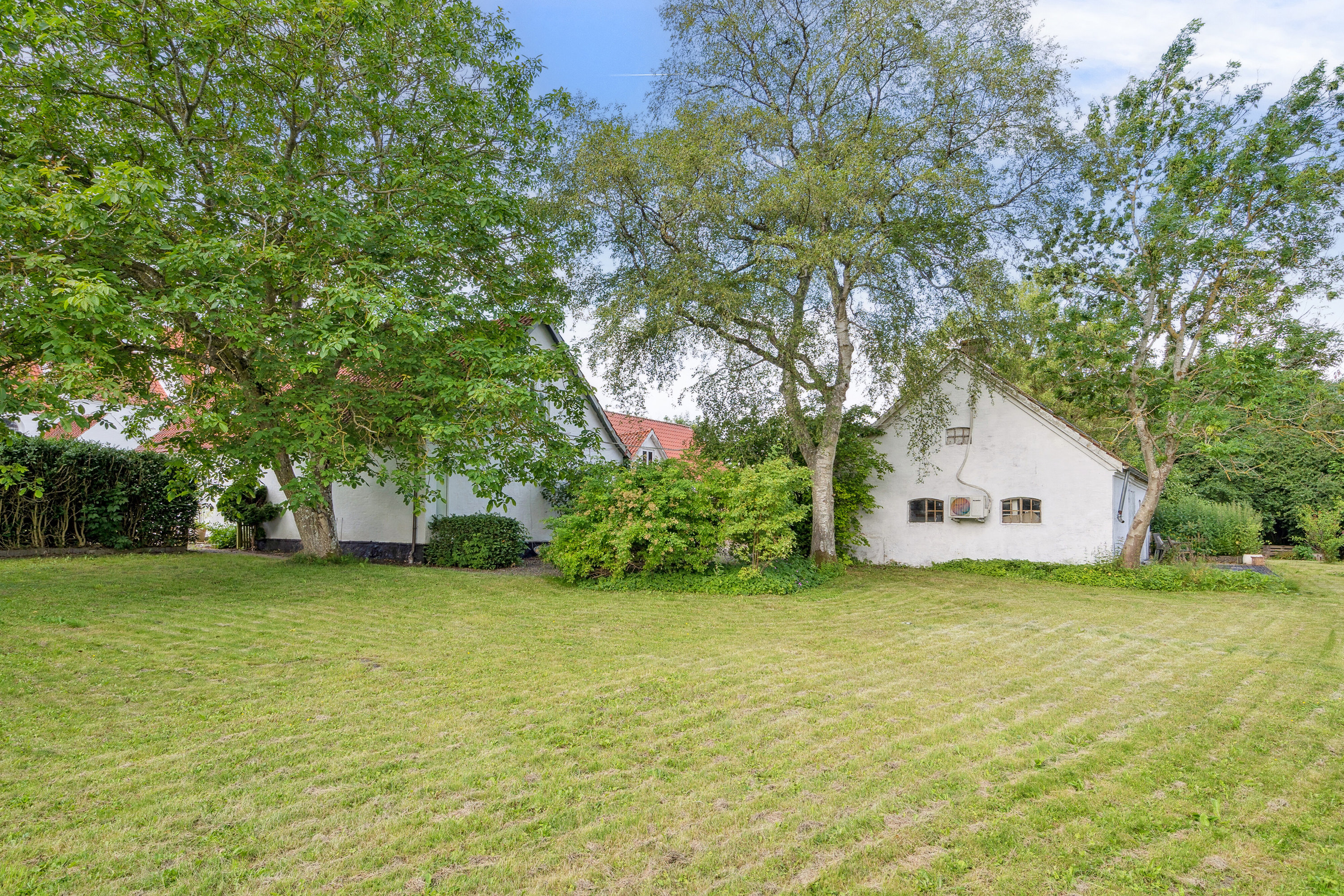 Fremhævet set fra haven billede i fuldskærmstilstand. Billede af Kirkevænget 12, Holme-Olstrup, 4684 Holmegaard