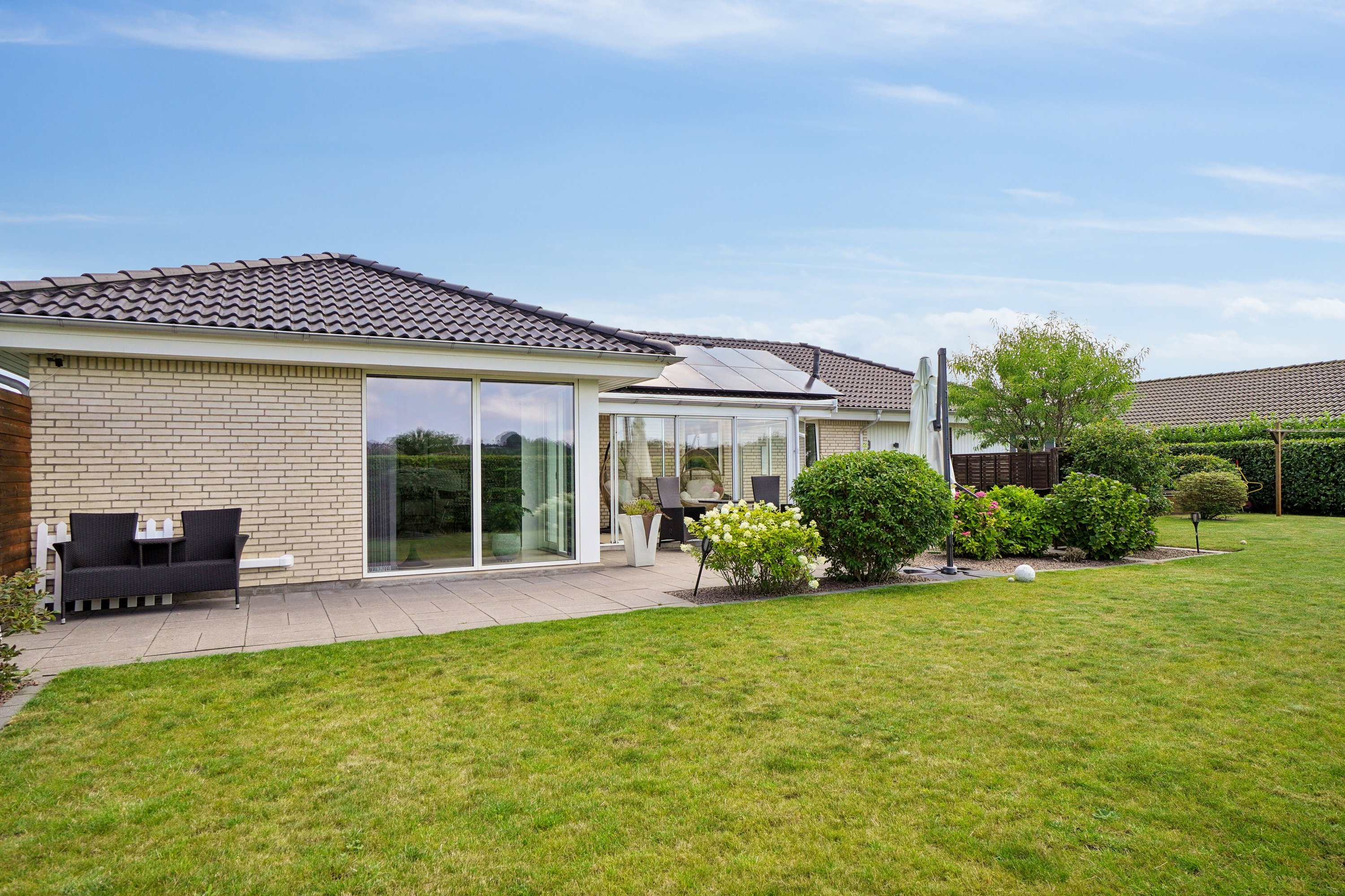 Fremhævet set fra haven billede i fuldskærmstilstand. Billede af Tårnvænget 30, Kregme Syd, 3300 Frederiksværk