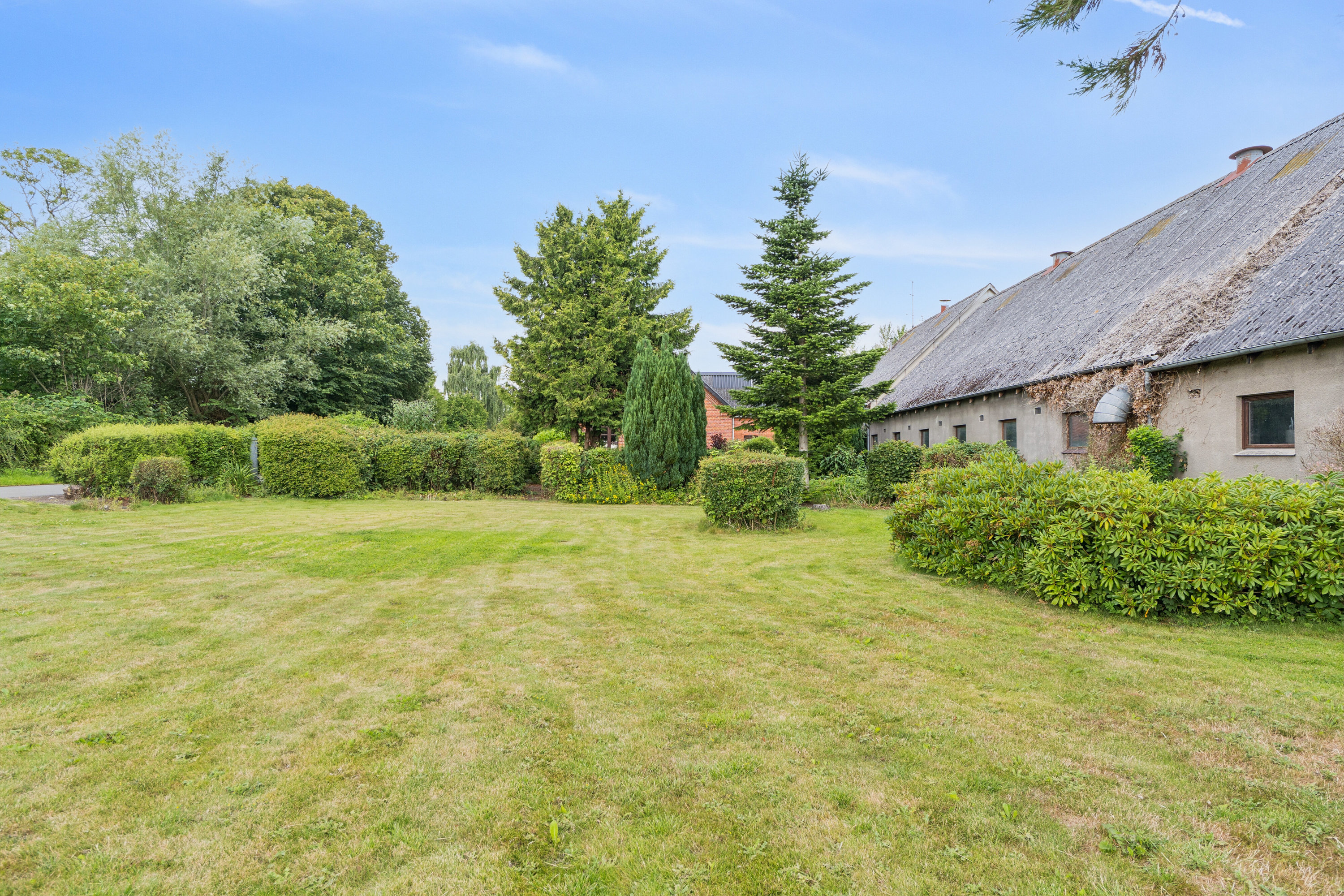 Fremhævet set fra haven billede i fuldskærmstilstand. Billede af Egensevej 32, Egense Mark, 5450 Otterup