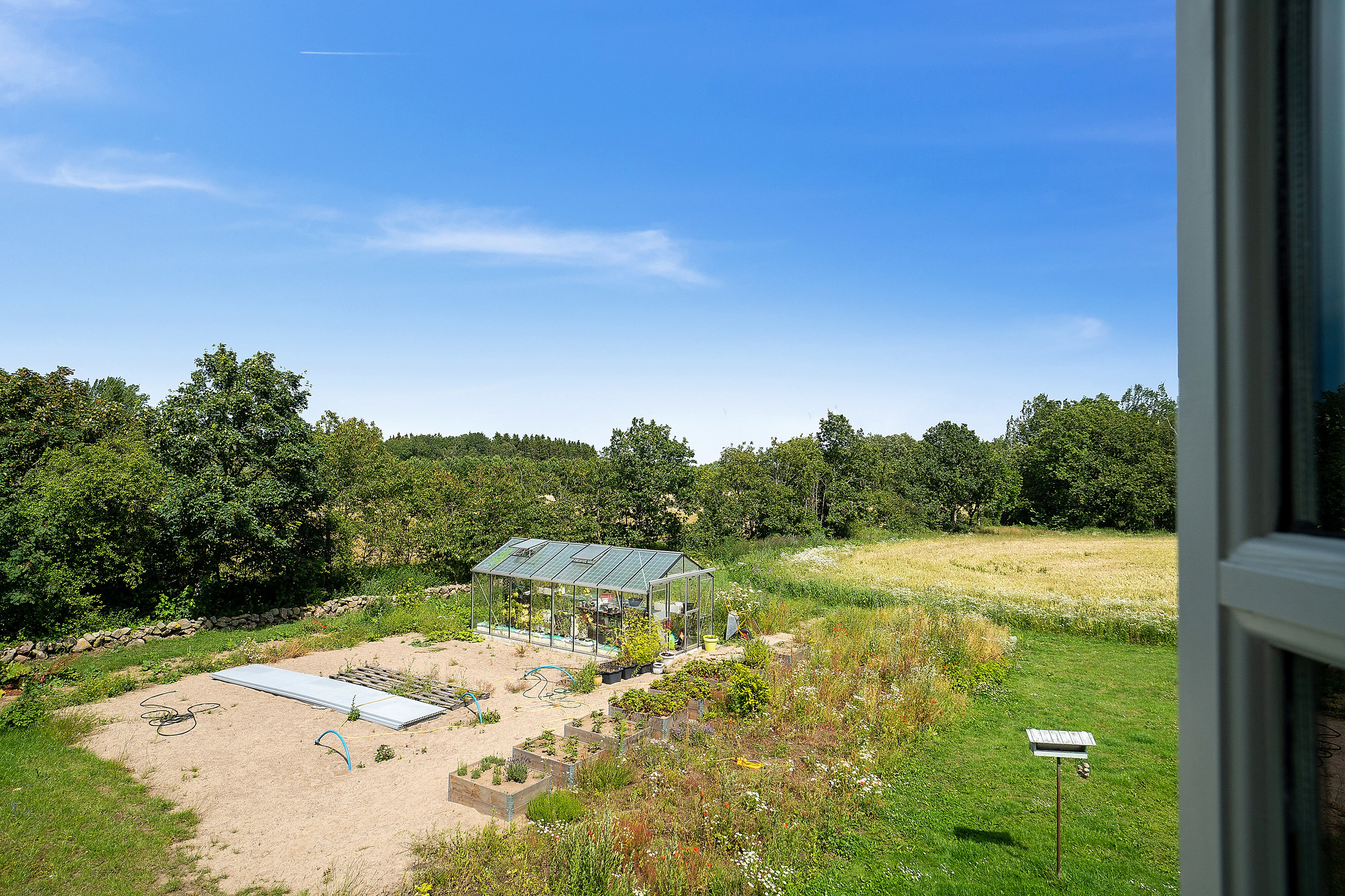 Fremhævet udsigt billede i fuldskærmstilstand. Billede af Puggevej 1, Rø, 3760 Gudhjem