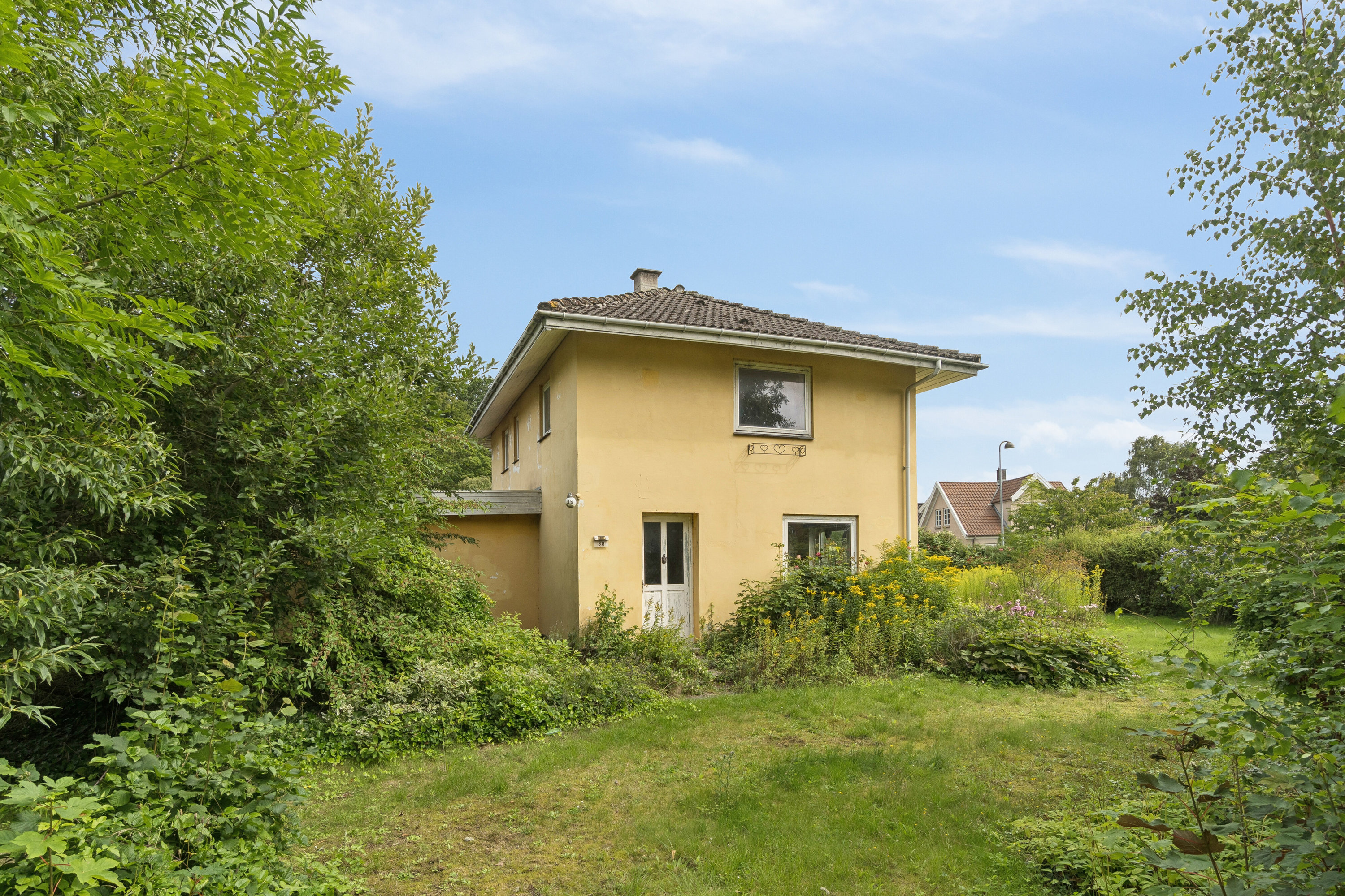 Fremhævet set fra haven billede i fuldskærmstilstand. Billede af Faxevej 38, 4654 Faxe Ladeplads