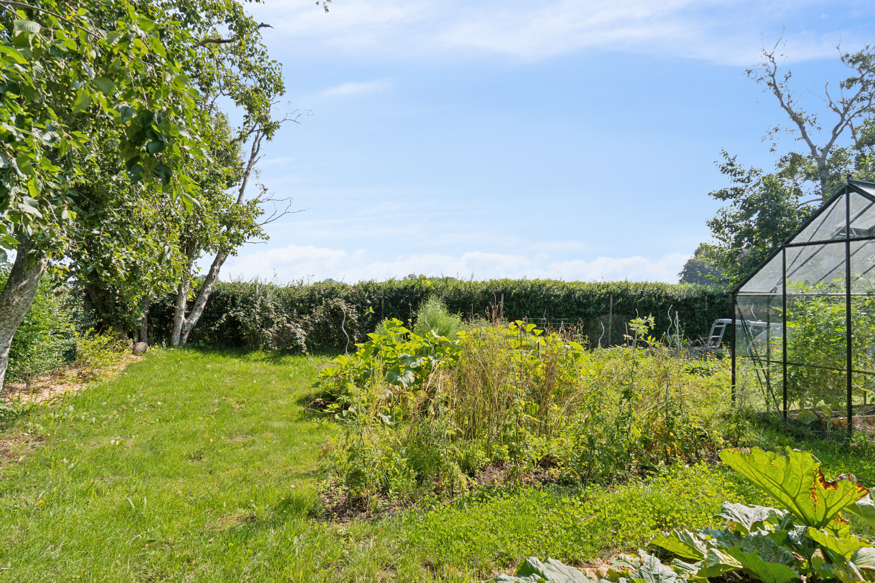 Fremhævet set fra haven billede i fuldskærmstilstand. Billede af Fugleholmvej 4, Hejninge, 4200 Slagelse