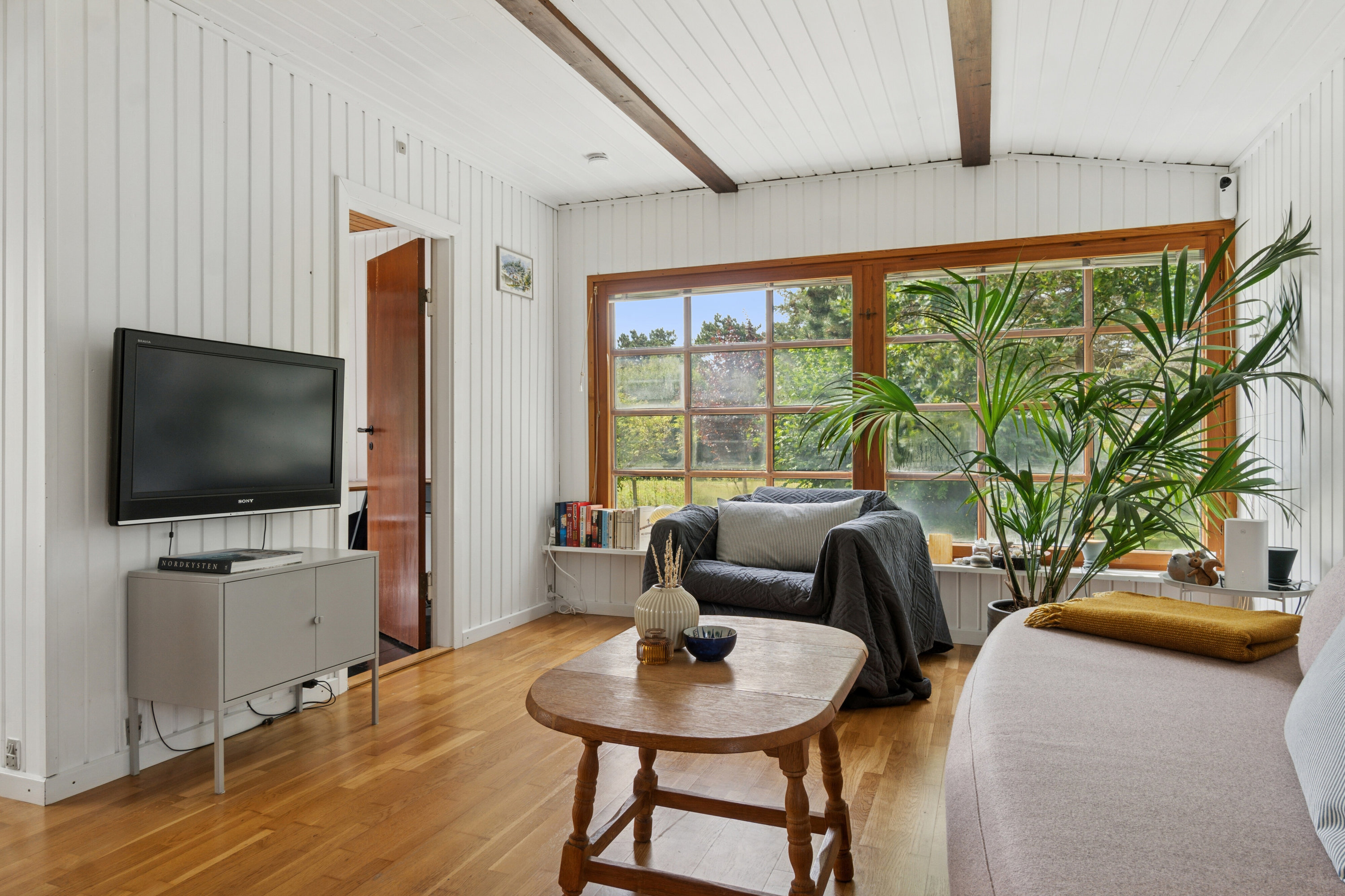 Fremhævet stue billede i fuldskærmstilstand. Billede af Klintevej 28, Hald Strand, 3390 Hundested