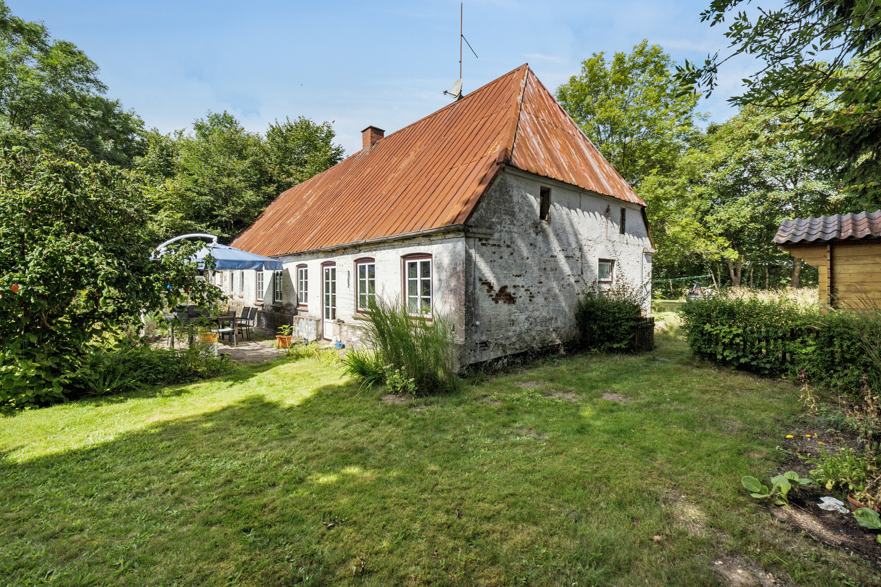 Fremhævet set fra haven billede i fuldskærmstilstand. Billede af Nørremark 1, Sdr Hygum, 6630 Rødding