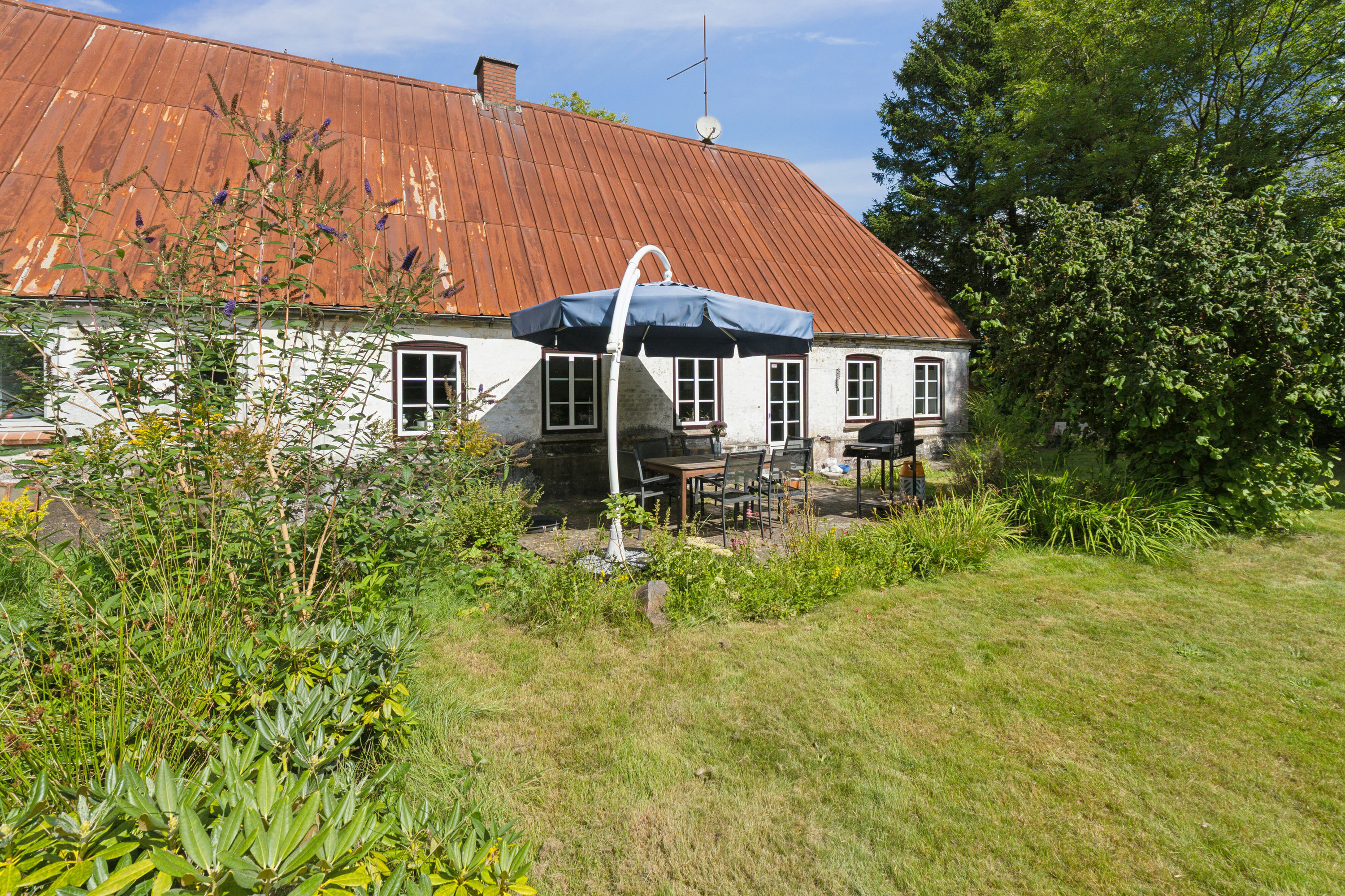 Fremhævet set fra haven billede i fuldskærmstilstand. Billede af Nørremark 1, Sdr Hygum, 6630 Rødding