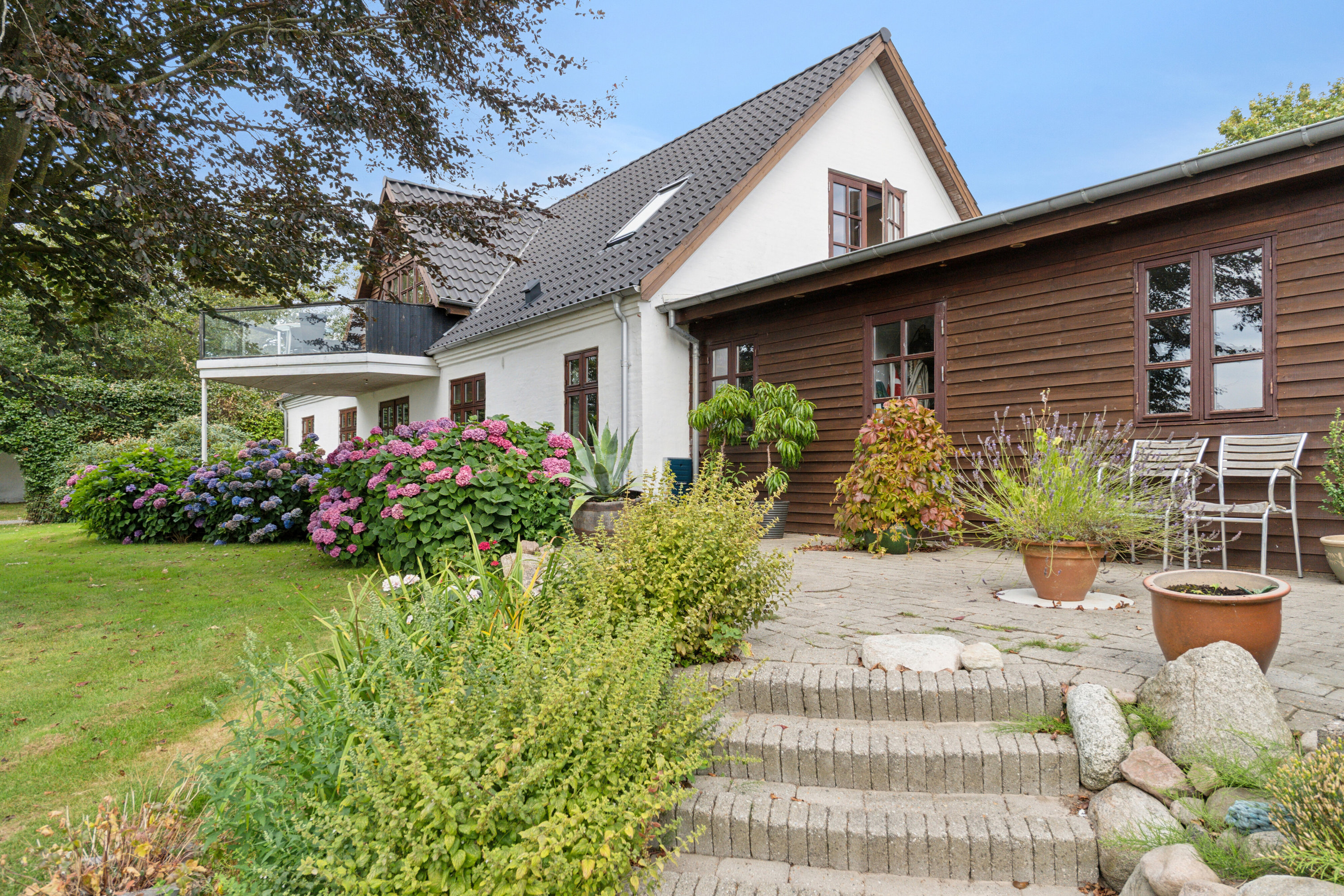 Fremhævet set fra haven billede i fuldskærmstilstand. Billede af Hvirrekærvej 148, Bjergby, 9800 Hjørring