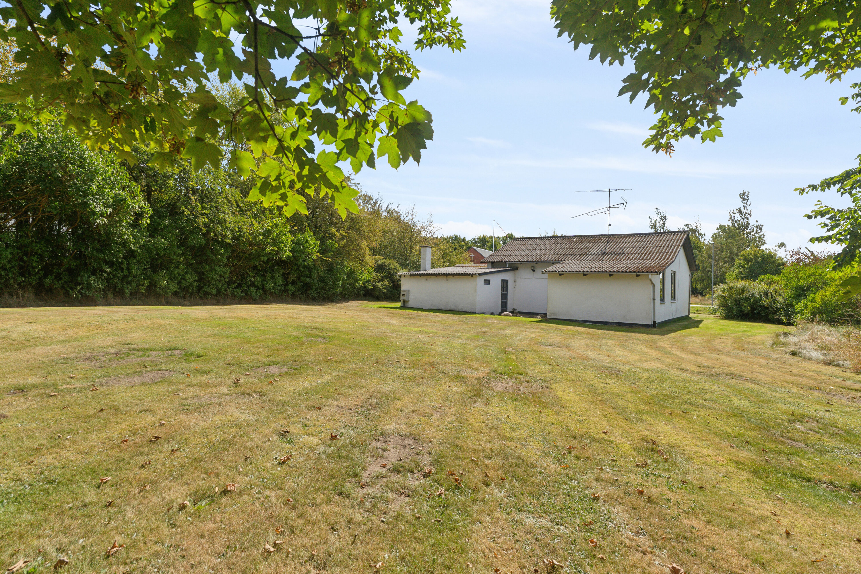 Fremhævet set fra haven billede i fuldskærmstilstand. Billede af Hørmestedvej 285, Hørmested, 9870 Sindal