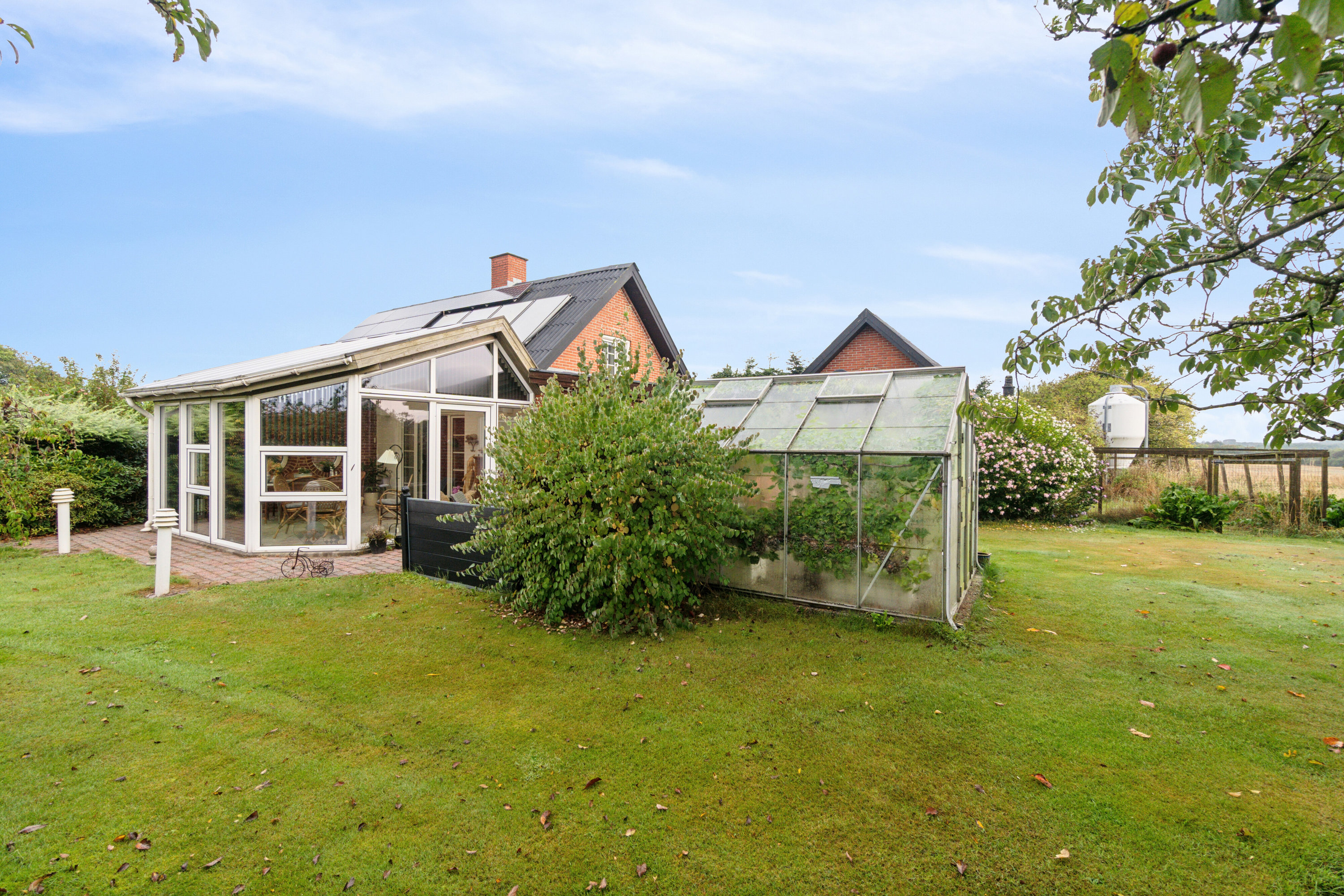 Fremhævet set fra haven billede i fuldskærmstilstand. Billede af Troldhøjvej 2, Skjoldborg, 7700 Thisted