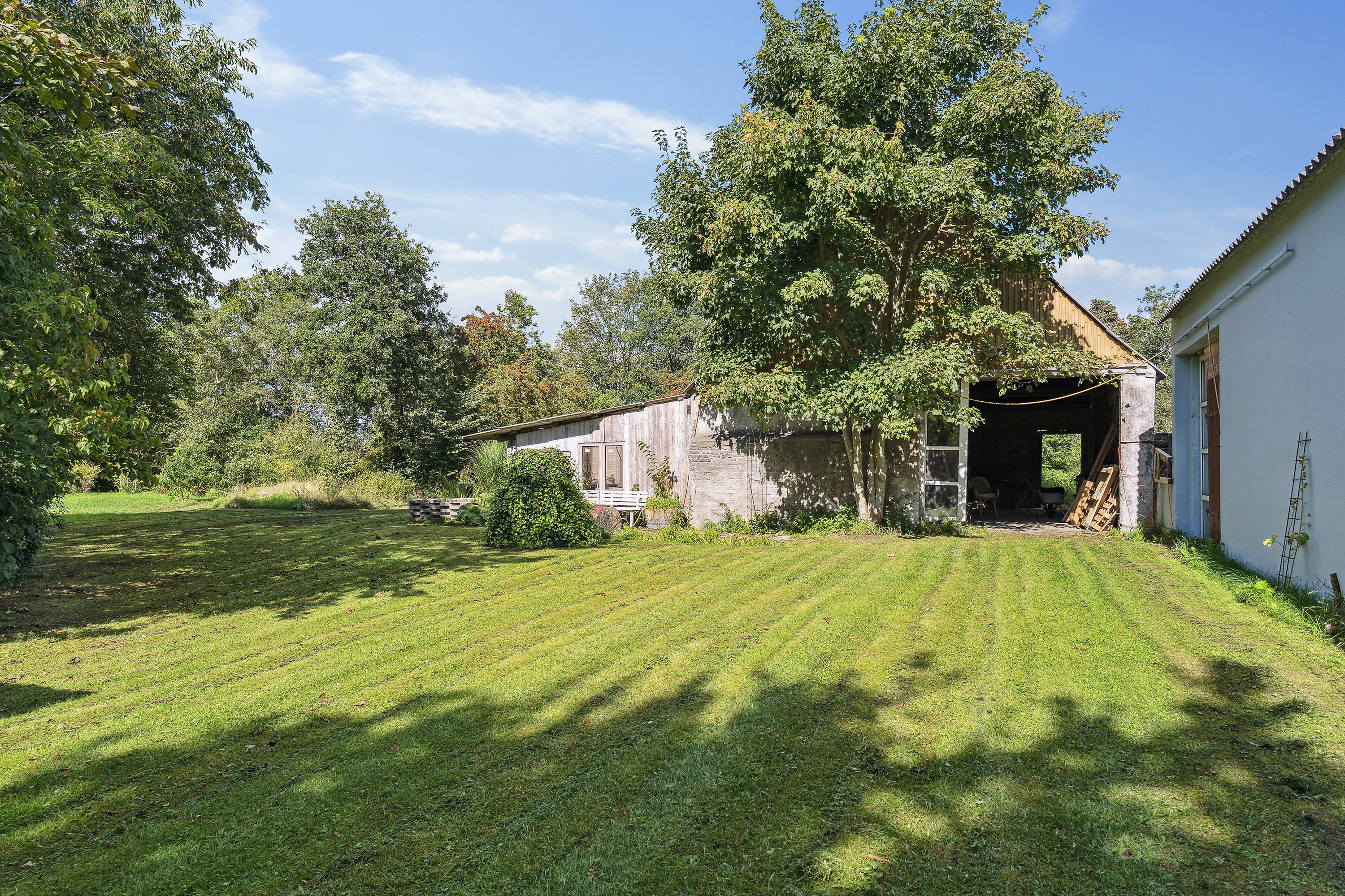 Fremhævet set fra haven billede i fuldskærmstilstand. Billede af Malmkærvej 6, Dyringhave, 7361 Ejstrupholm