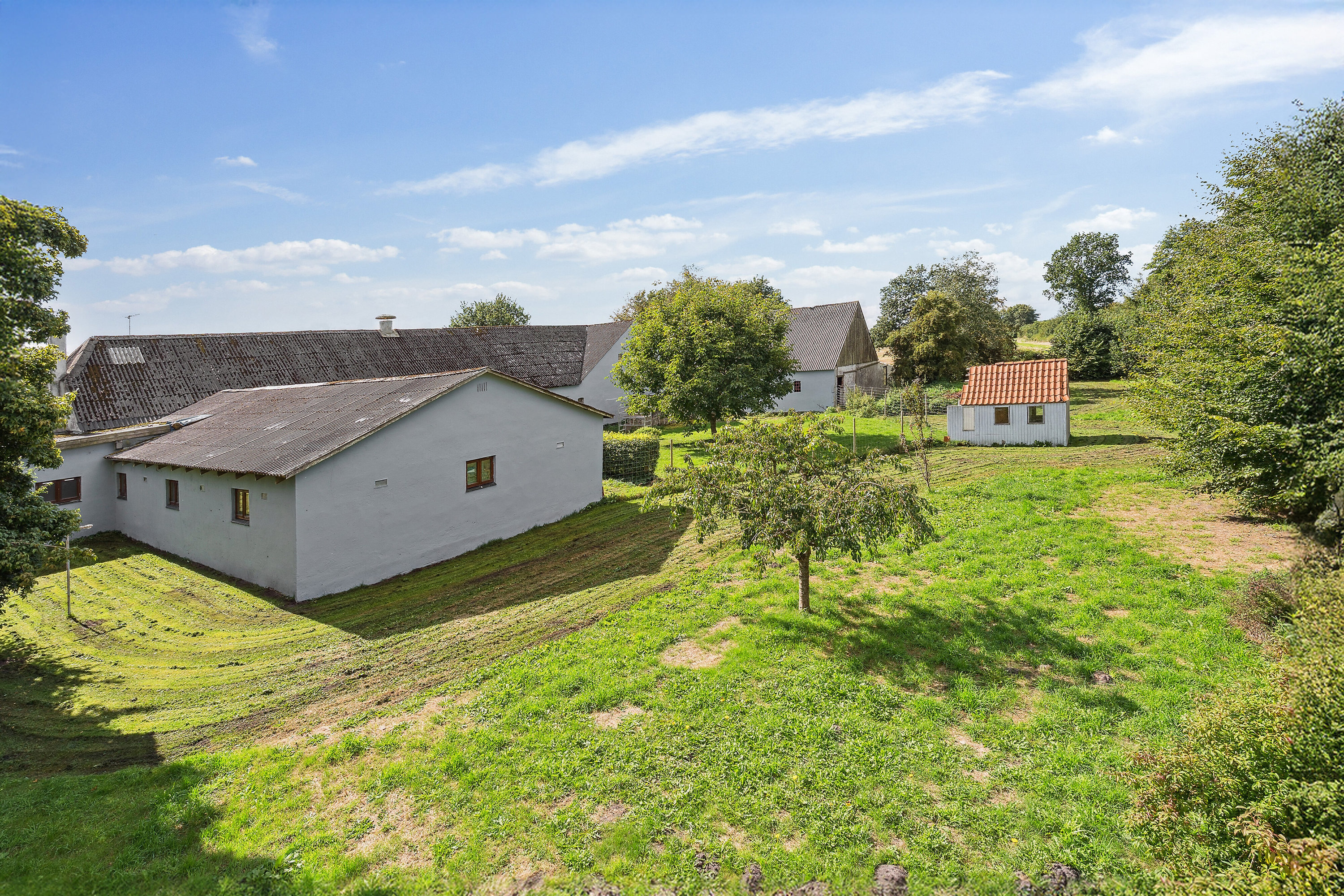 Fremhævet set fra haven billede i fuldskærmstilstand. Billede af Malmkærvej 6, Dyringhave, 7361 Ejstrupholm