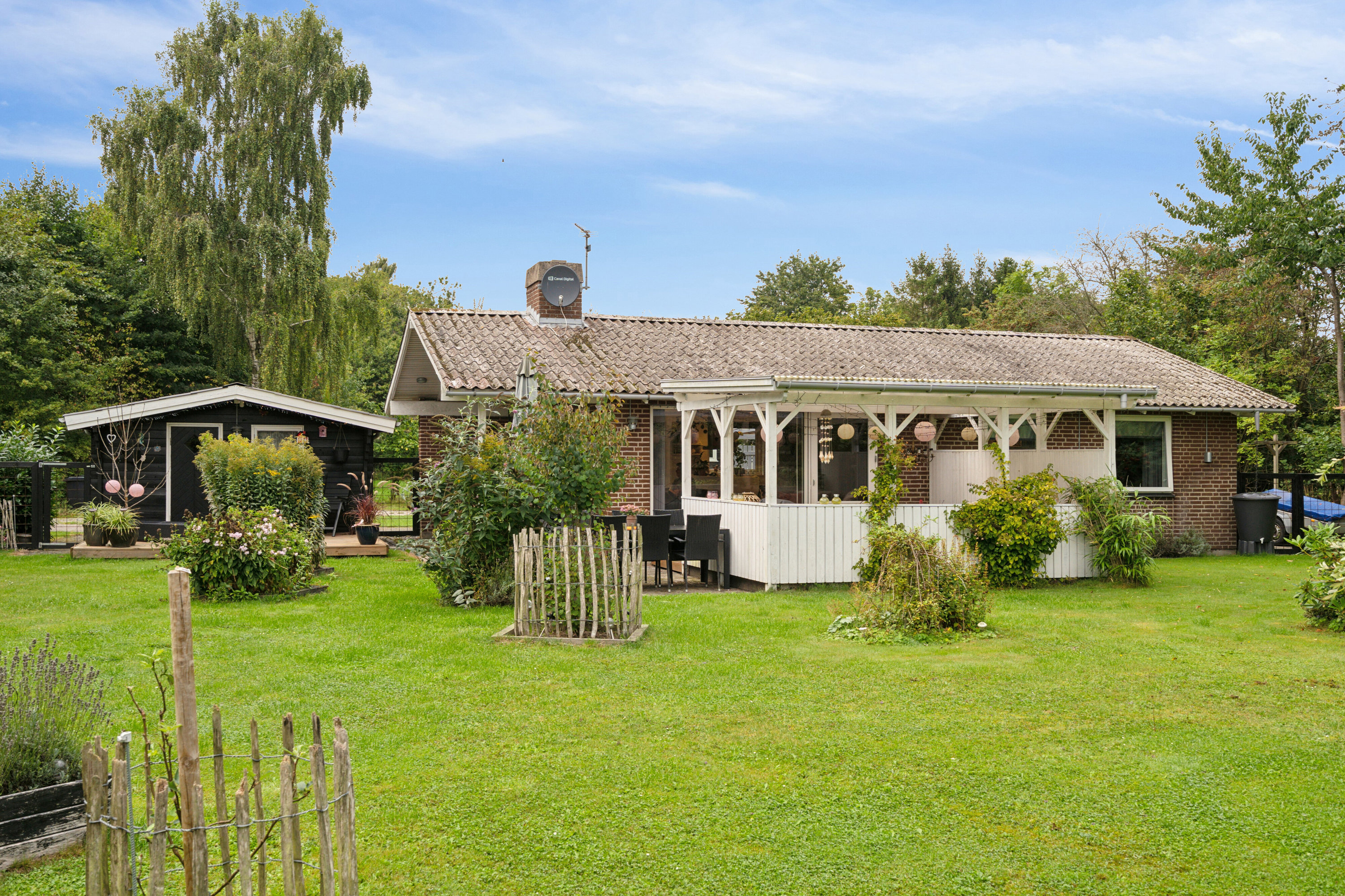 Fremhævet set fra haven billede i fuldskærmstilstand. Billede af Hedvigsvej 8A, 4654 Faxe Ladeplads