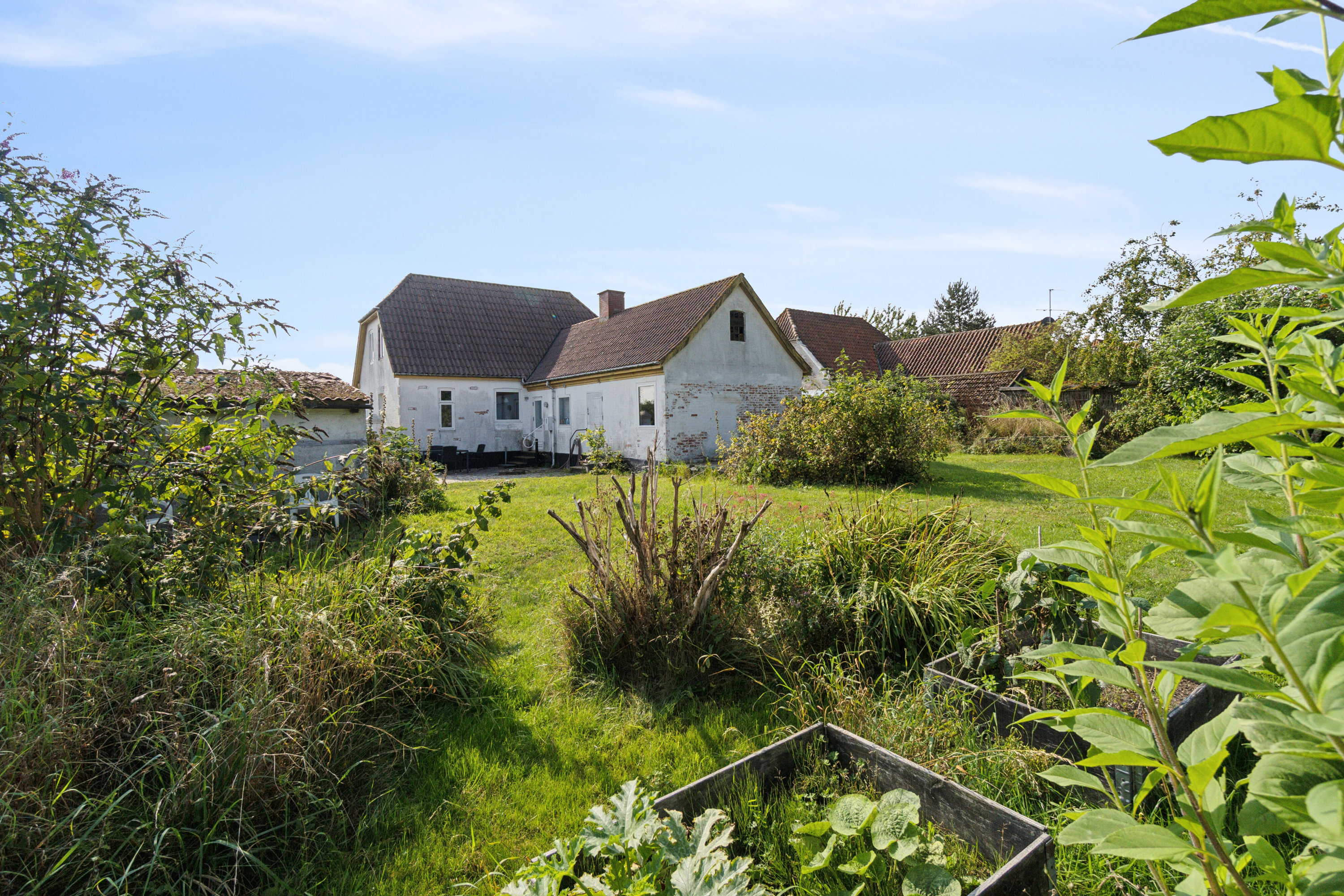 Fremhævet set fra haven billede i fuldskærmstilstand. Billede af Stavsdalvej 12, Østerlars, 3760 Gudhjem