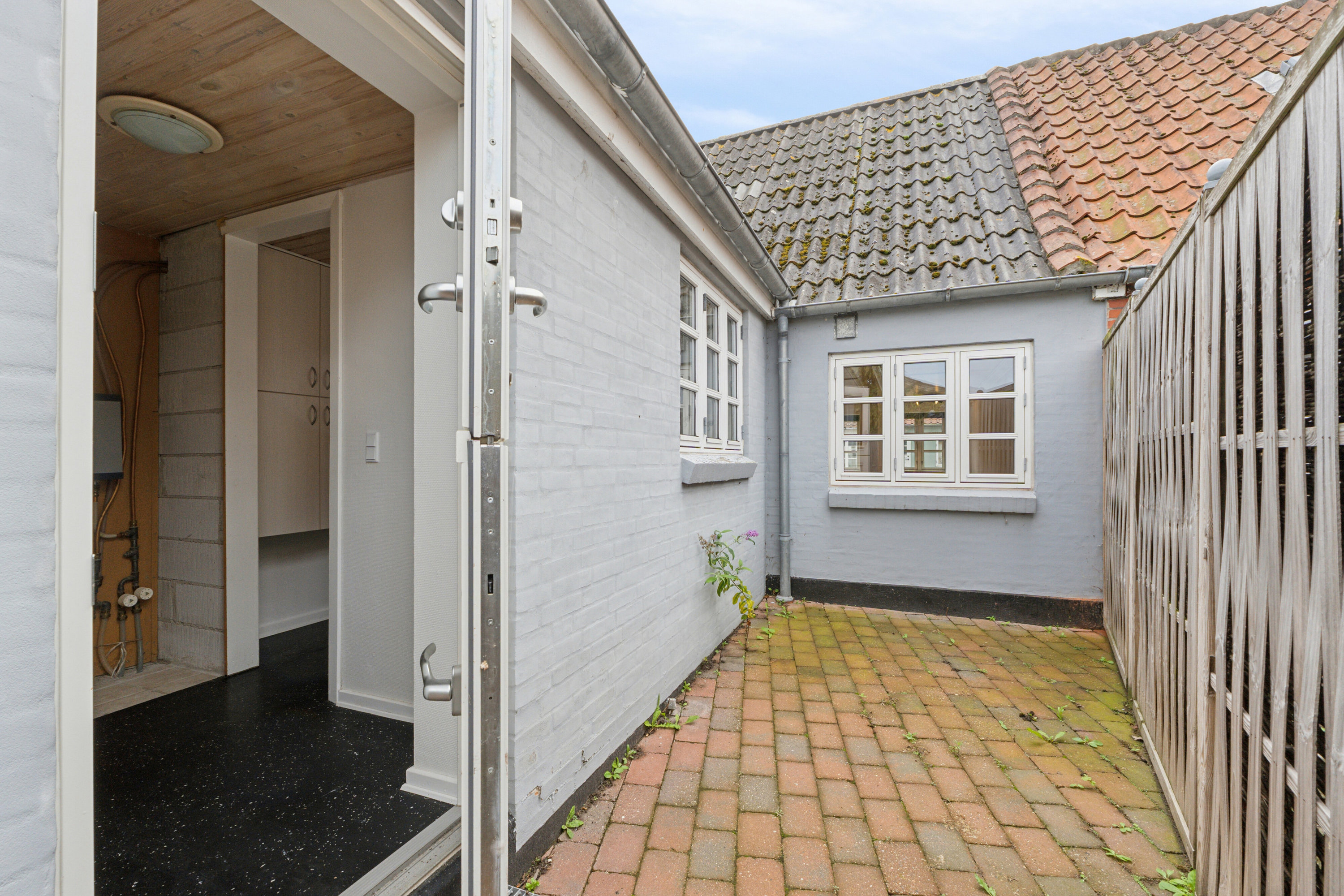 Fremhævet gårdmiljø billede i fuldskærmstilstand. Billede af Nørrebro 61, 5900 Rudkøbing