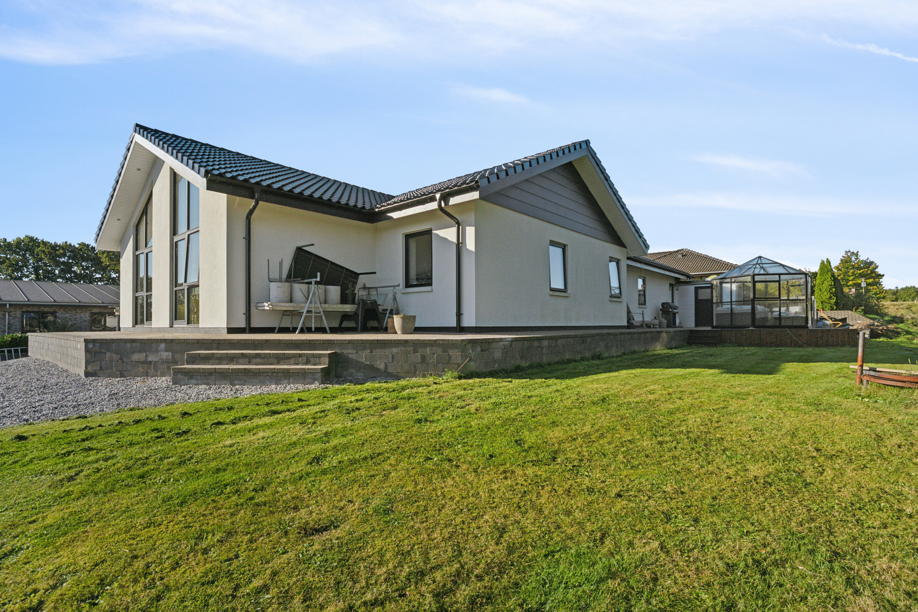 Fremhævet set fra haven billede i fuldskærmstilstand. Billede af Nørrelund 17, 9870 Sindal