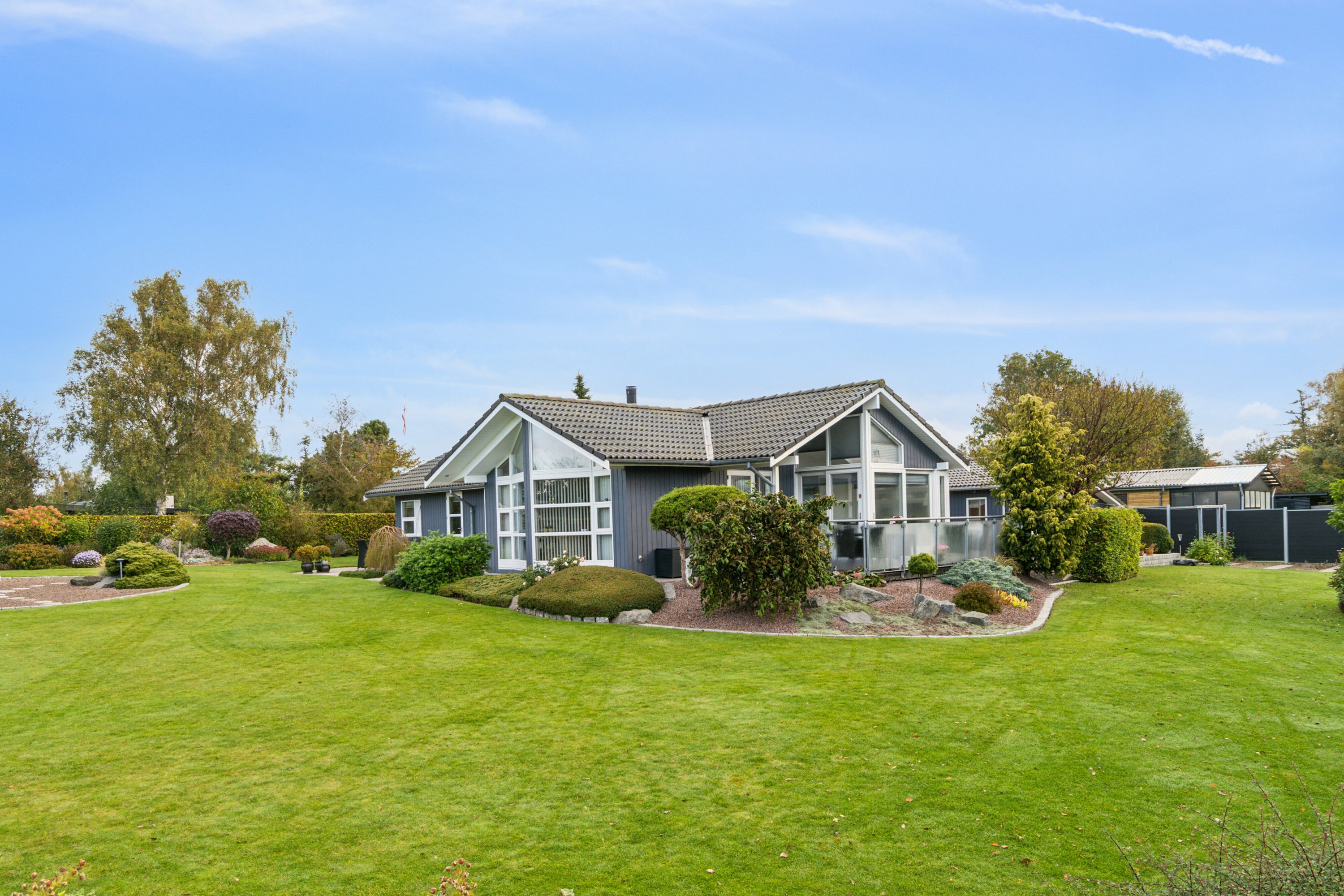 Fremhævet set fra haven billede i fuldskærmstilstand. Billede af Solsortevej 4, Kongsmark, 4200 Slagelse