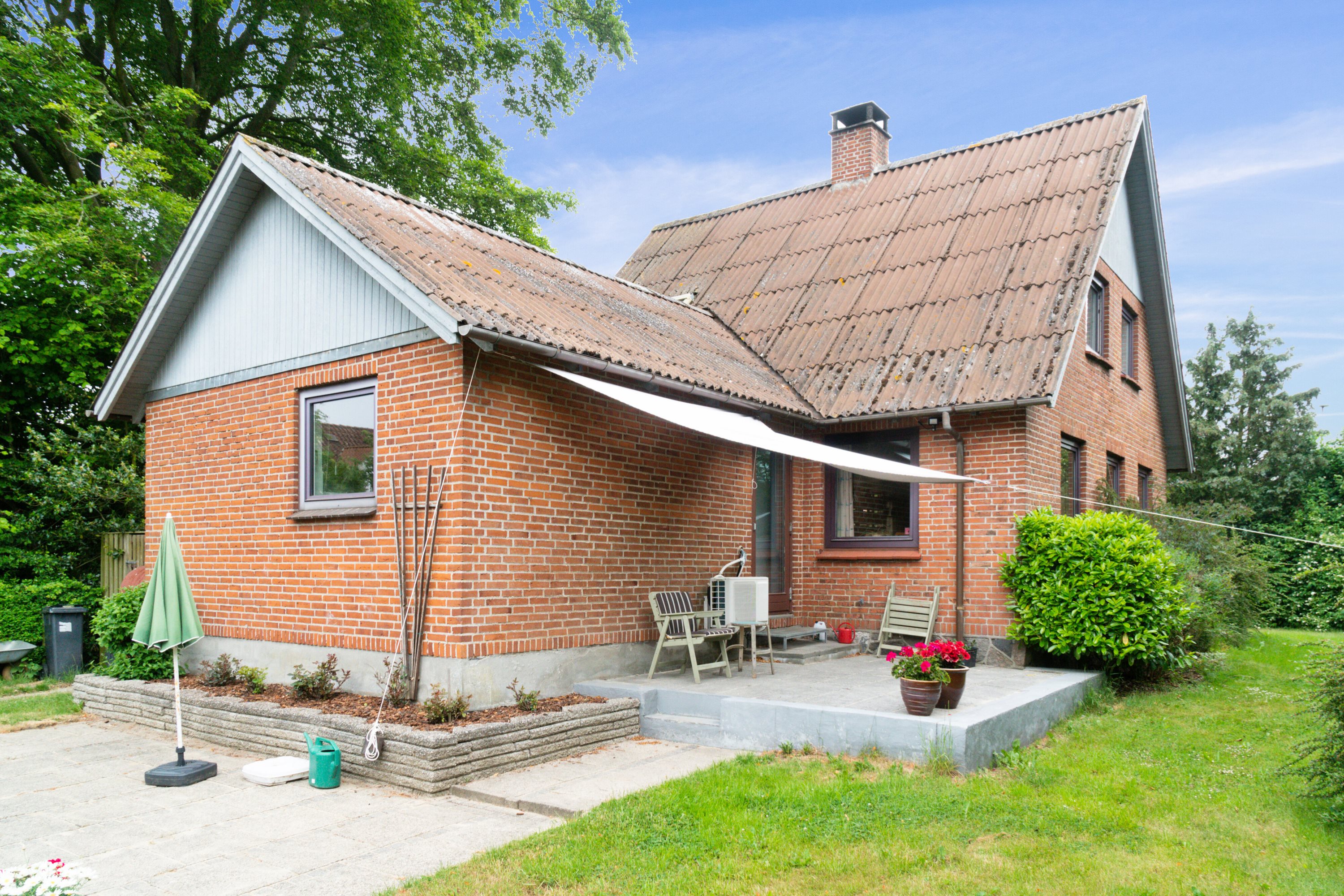 Fremhævet set fra haven billede i fuldskærmstilstand. Billede af Vestergårdsvej 4, Boulstrup, 8300 Odder