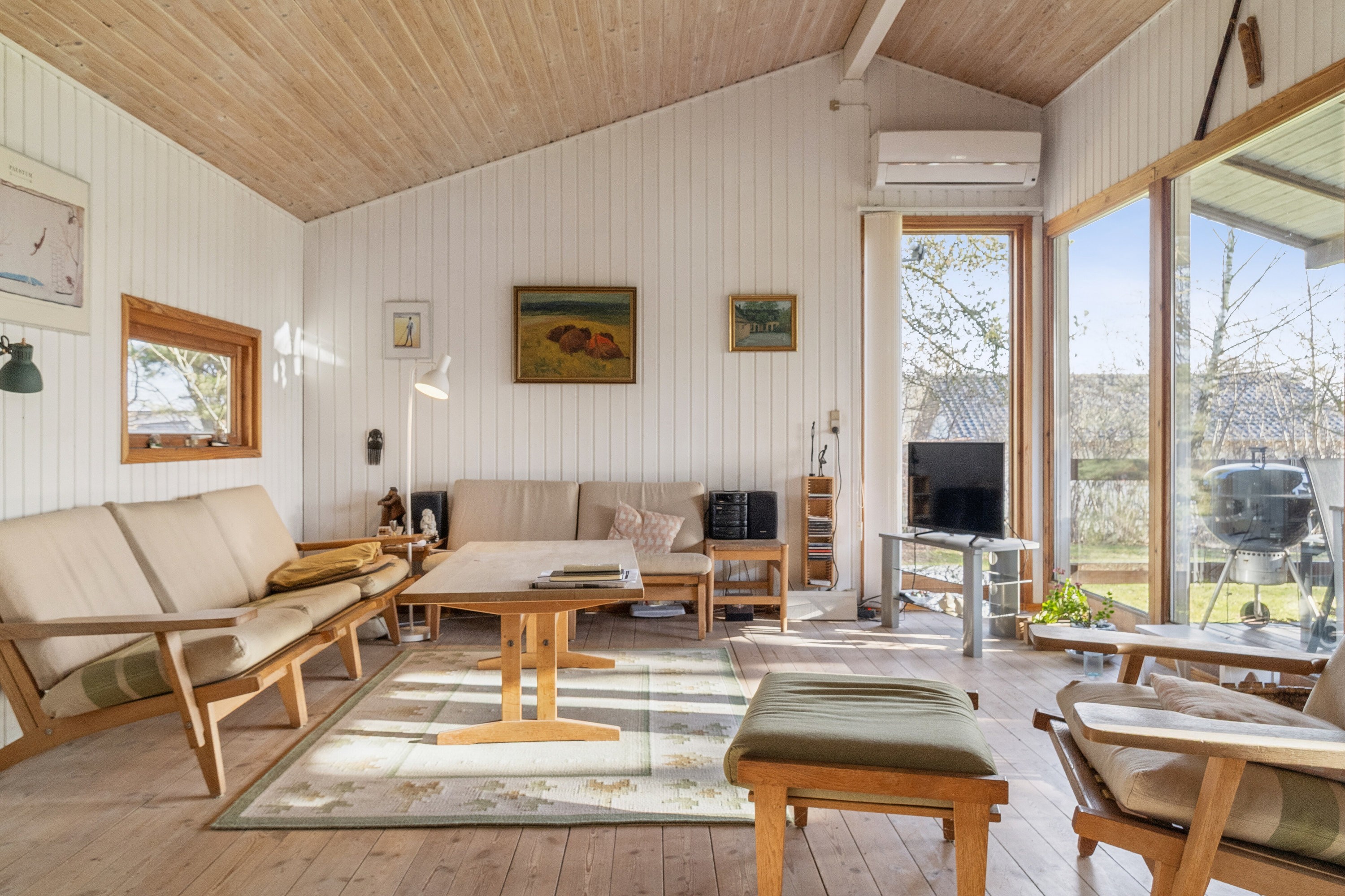 Fremhævet stue billede i fuldskærmstilstand. Billede af Mathilde Nielsensvej 8, Evetofte, 3370 Melby