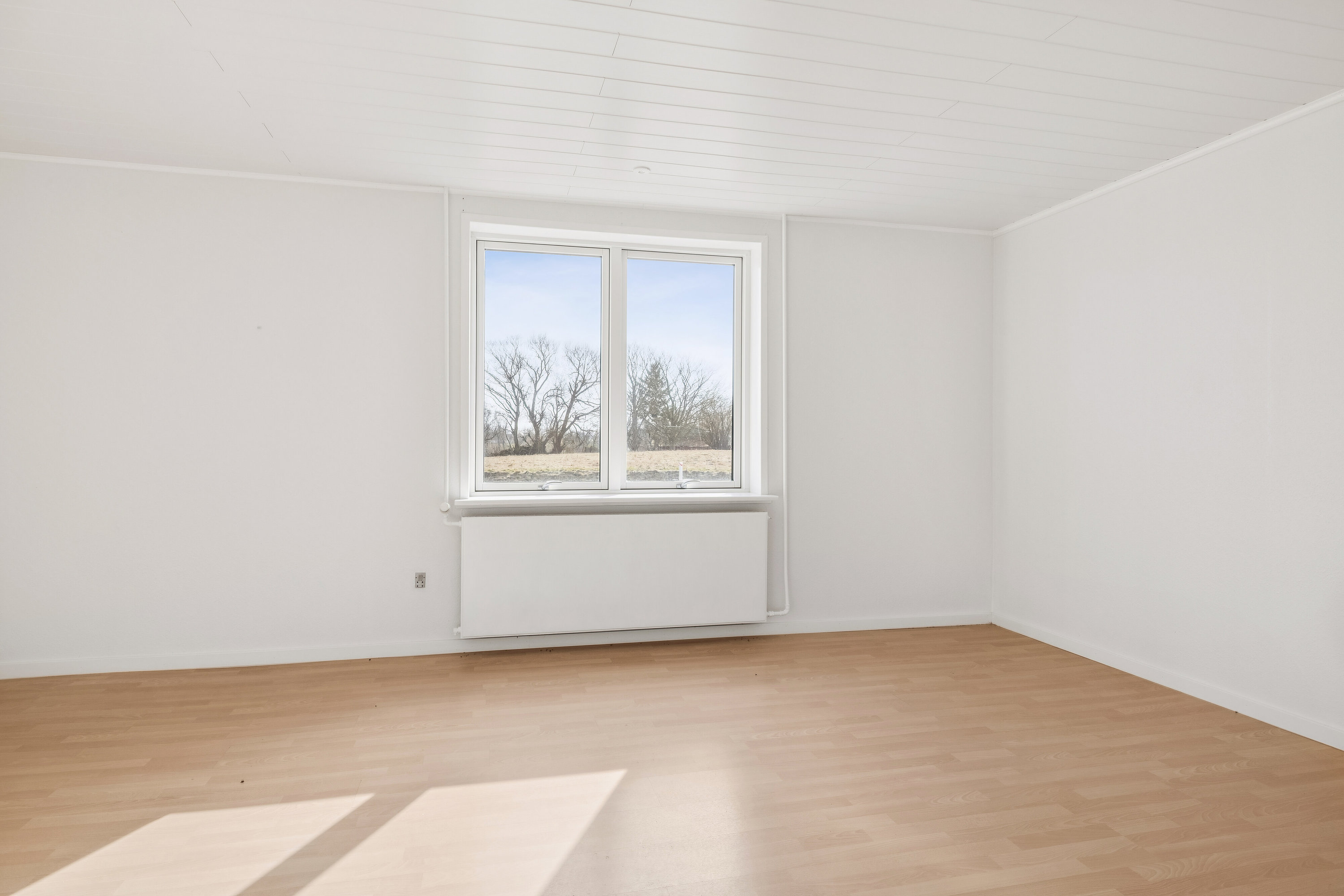 Fremhævet stue billede i fuldskærmstilstand. Billede af Nordre Landevej 43, Simmerbølle, 5900 Rudkøbing