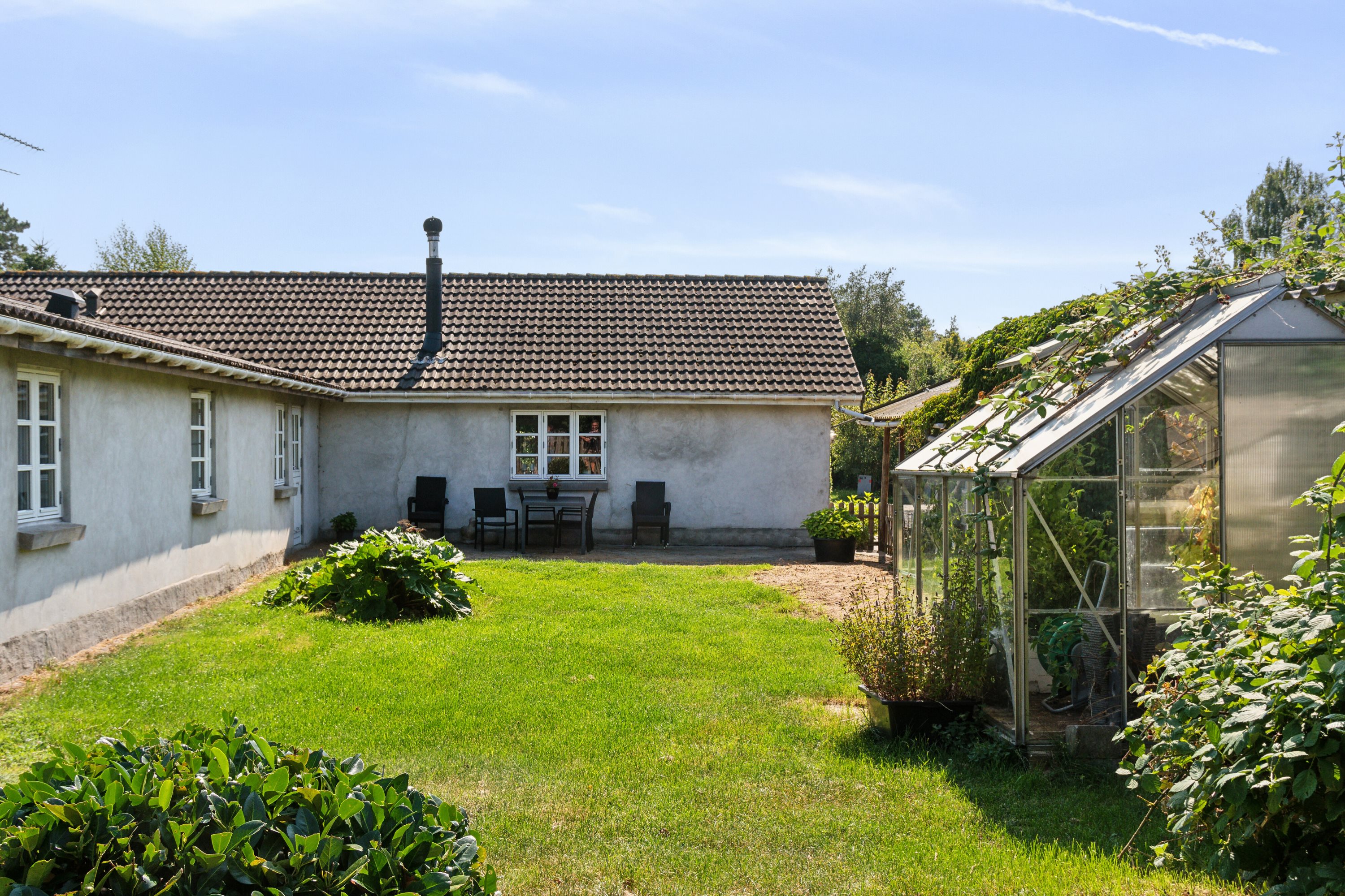 Fremhævet set fra haven billede i fuldskærmstilstand. Billede af Lærkevej 34, Ellinge Lyng, 4560 Vig